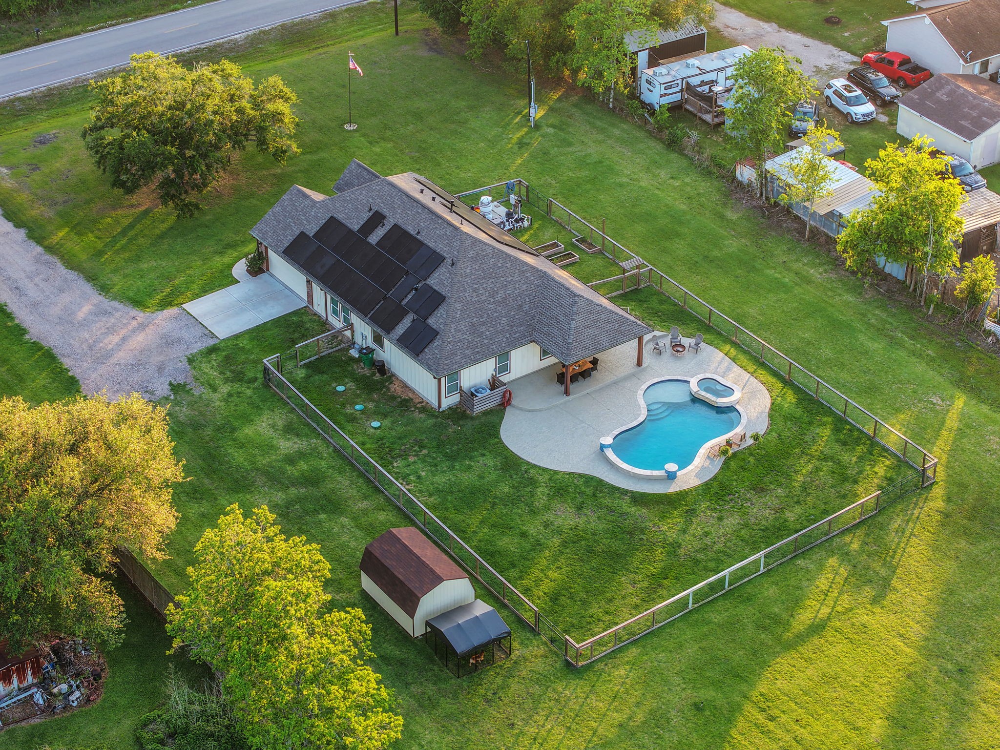 Spacious single-story home with solar panels, a beautifully landscaped yard, and a stunning pool with a spa.