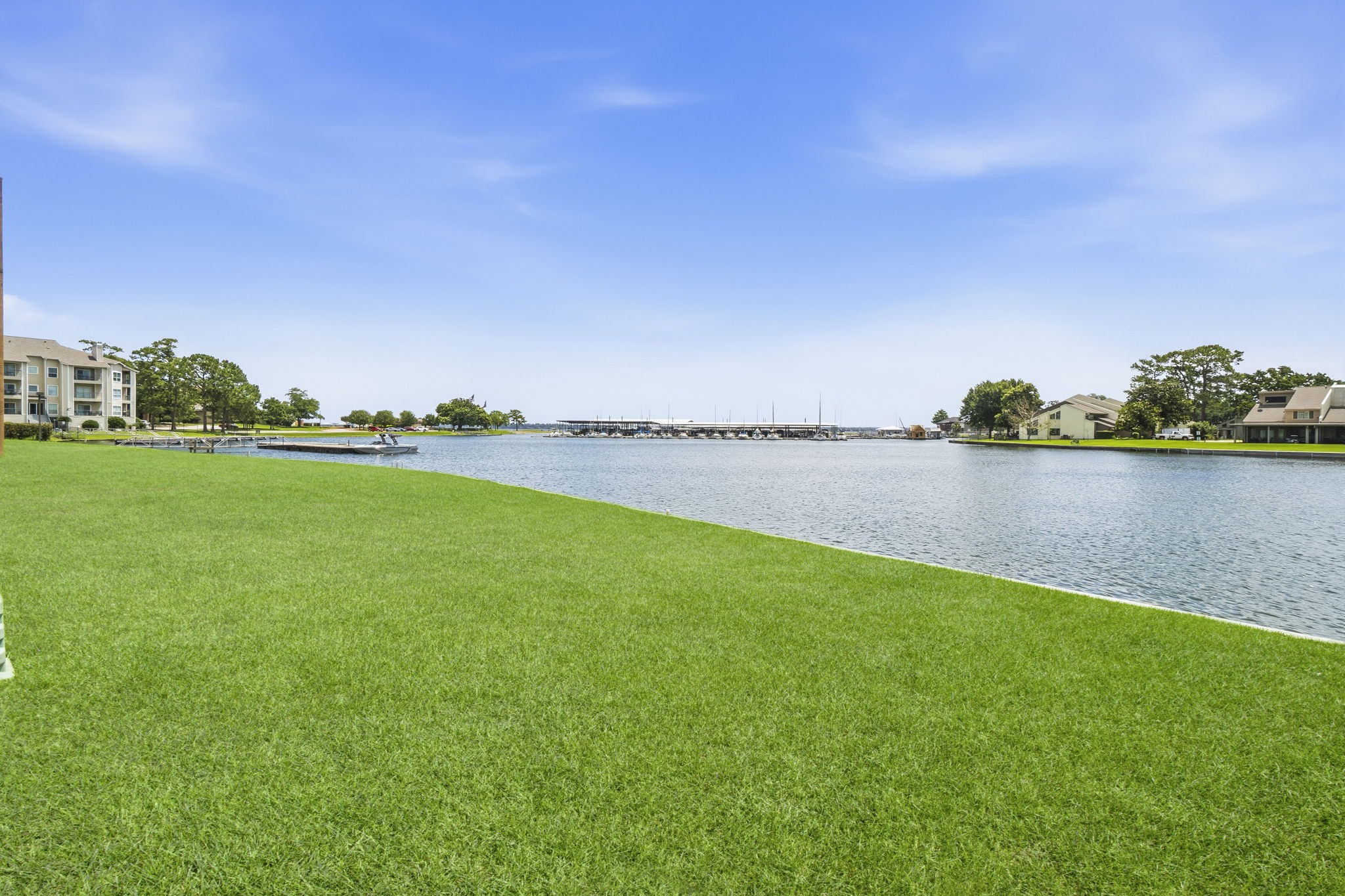 Wide-open water views and beautifully maintained grounds create a peaceful atmosphere that feels like a year-round vacation.