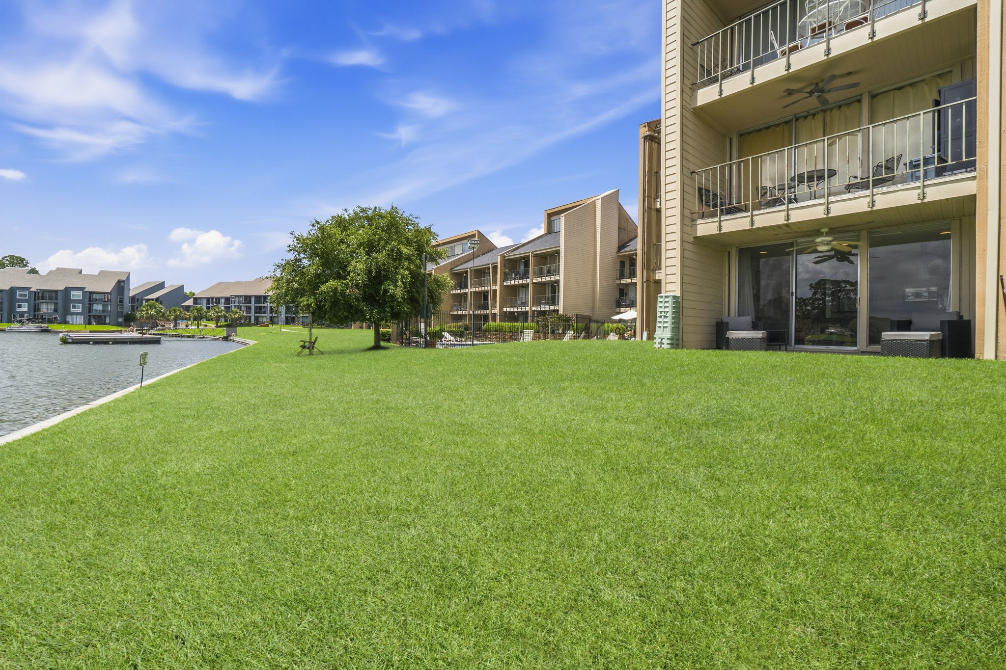 Enjoy easy access from your private patio directly to the beautifully maintained grounds and waterfront common area.