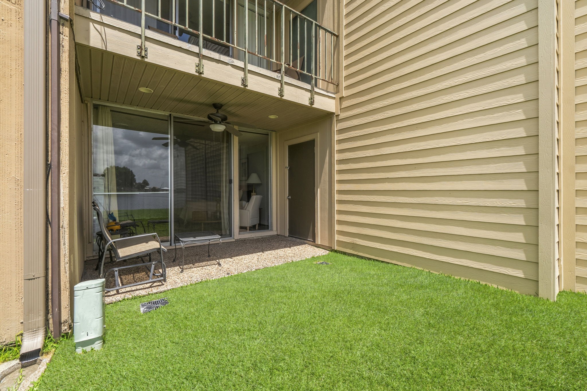 This covered patio offers the perfect blend of comfort and convenience, creating an ideal spot to enjoy fresh air, lake breezes, and peaceful surroundings year-round.