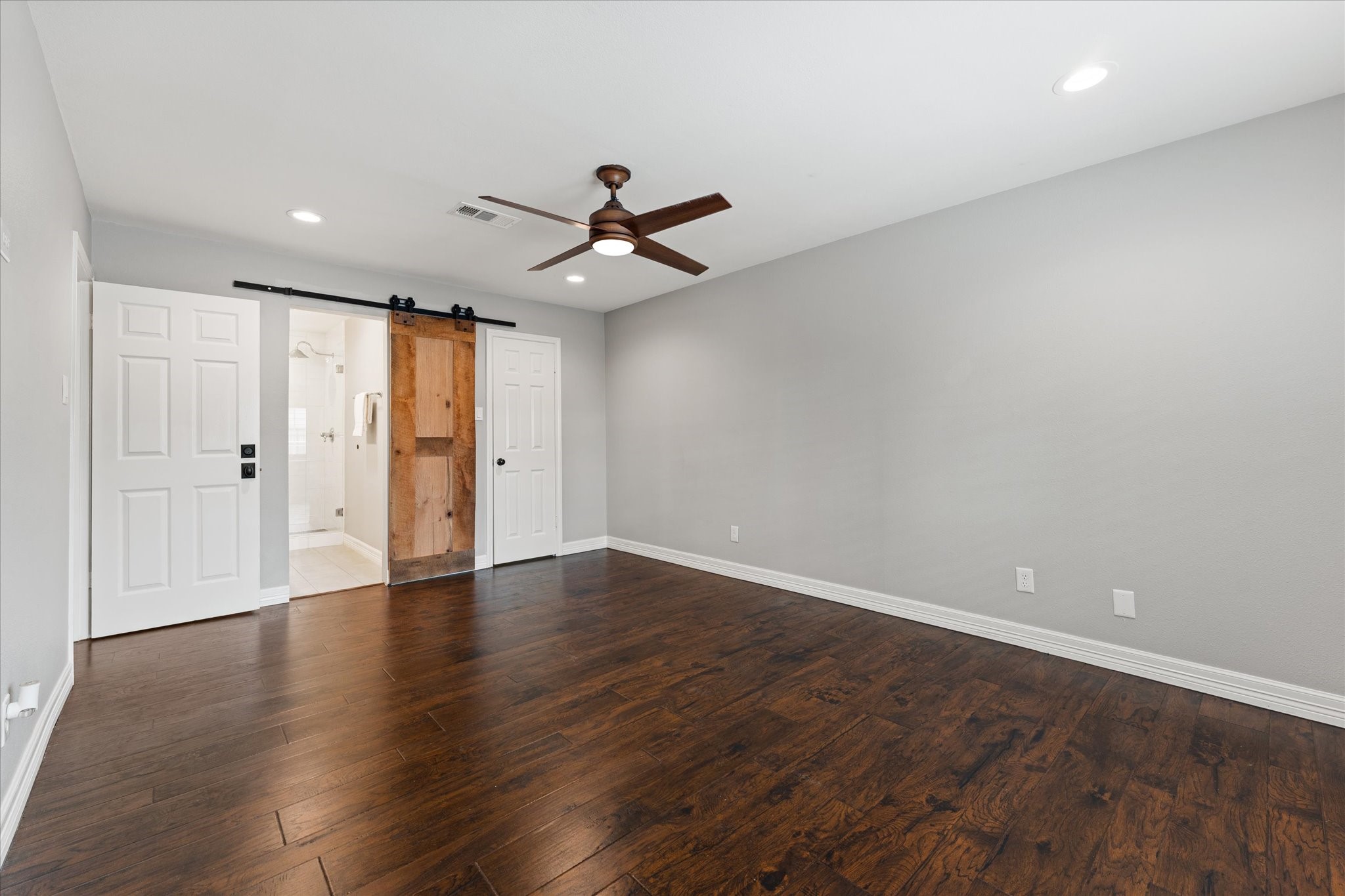 Barn door to primary bath