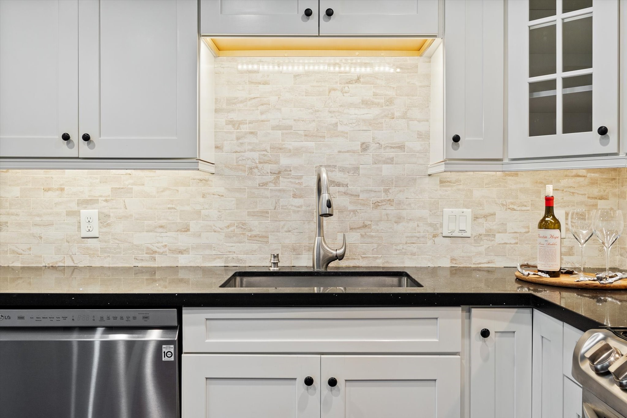 Upgraded kitchen with undermount cabinet lighting and soft close cabinets
