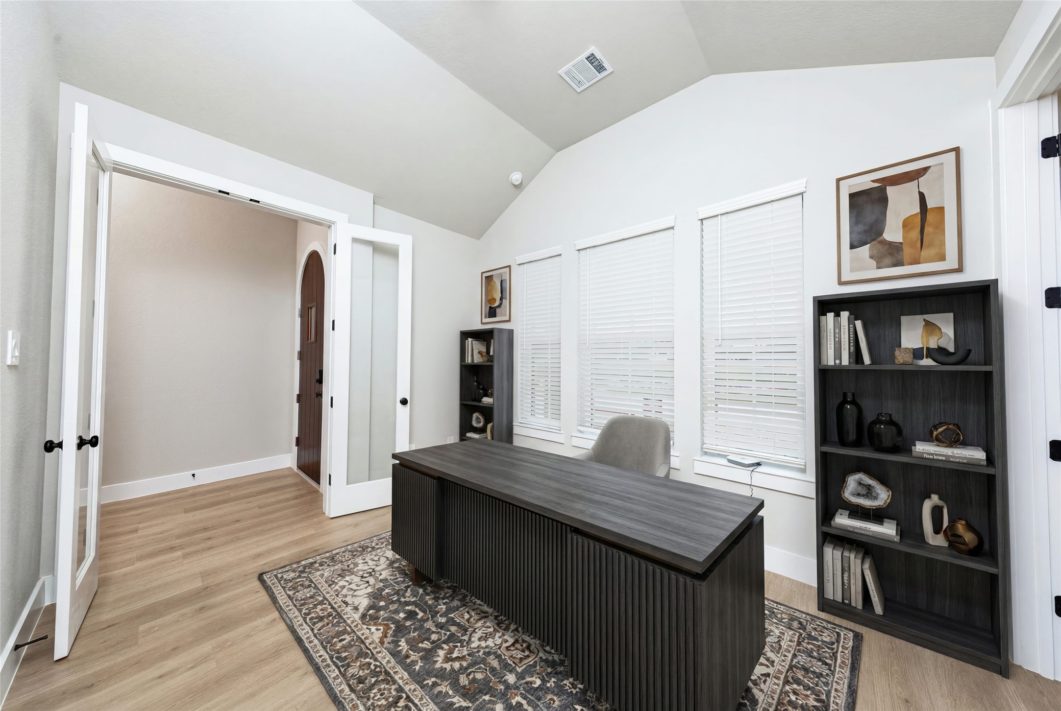 This handsome home office features tile flooring, large windows, cathedral ceilings, custom paint, walk-in closet, and gorgeous French doors for added privacy! *Virtually Staged
