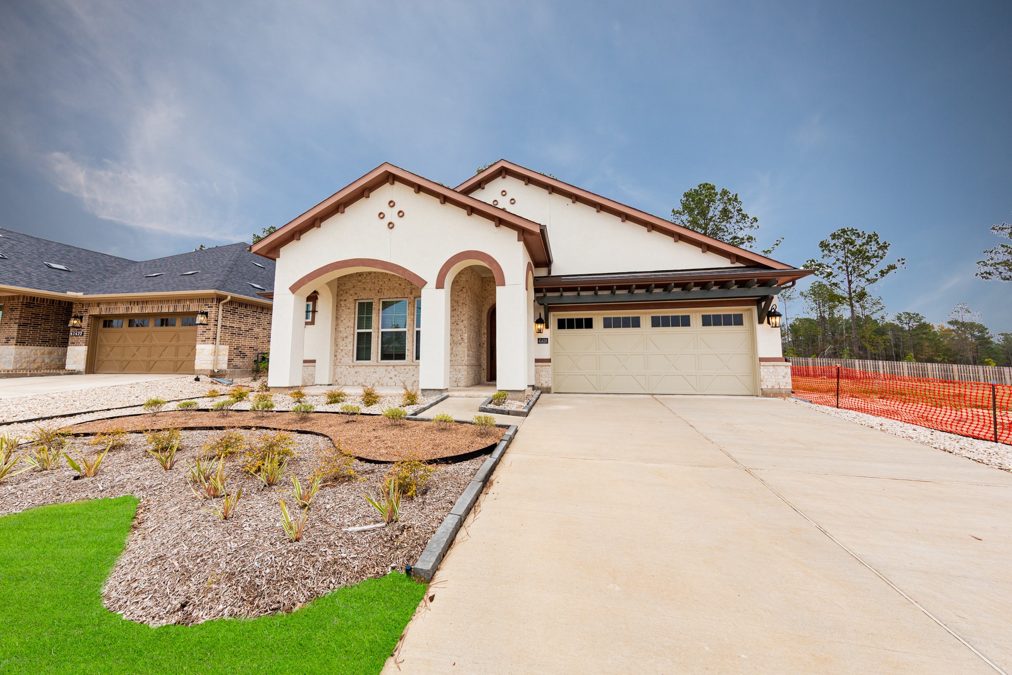 Welcome home to 41418 Threadgill Way located in COLTON and zoned to Magnolia ISD! This single-story home features a Spanish-inspired elevation with a smooth stucco exterior, characterized by a prominent arched entryway and decorative quatrefoil accents.