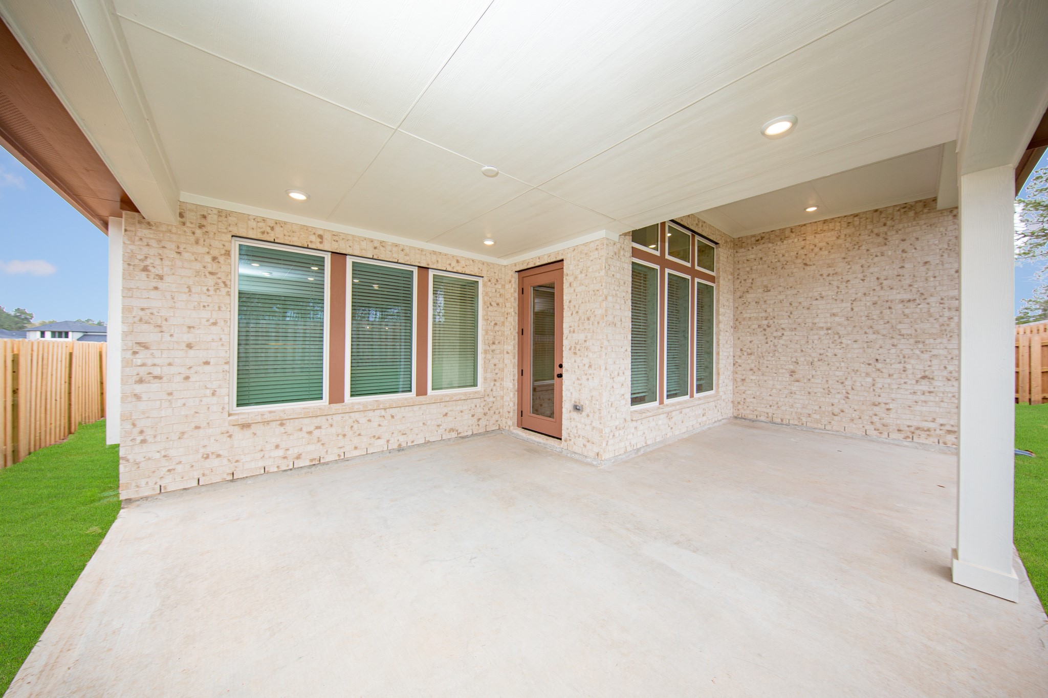 Step outside to the covered rear patio, the perfect extension of your indoor living space for year-round enjoyment.