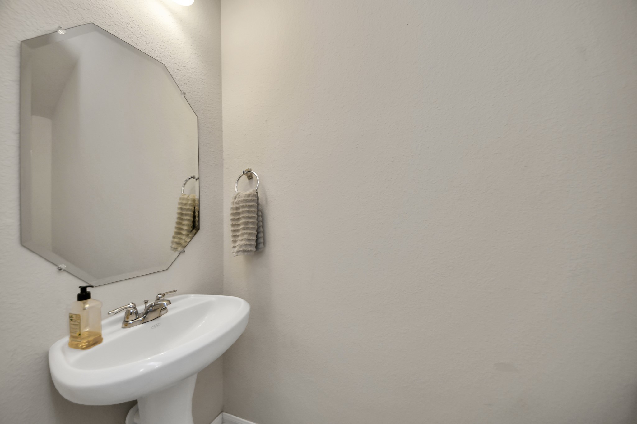 Powder room, located downstairs.