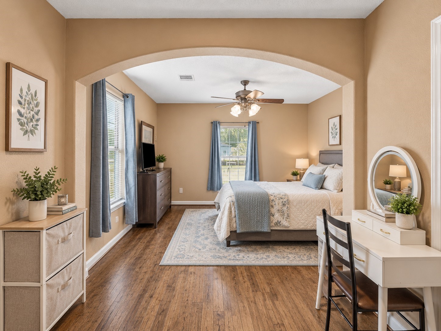 This oversized primary retreat offers room to spread out, complete with a cozy reading nook or vanity space and warm wood-look flooring throughout.