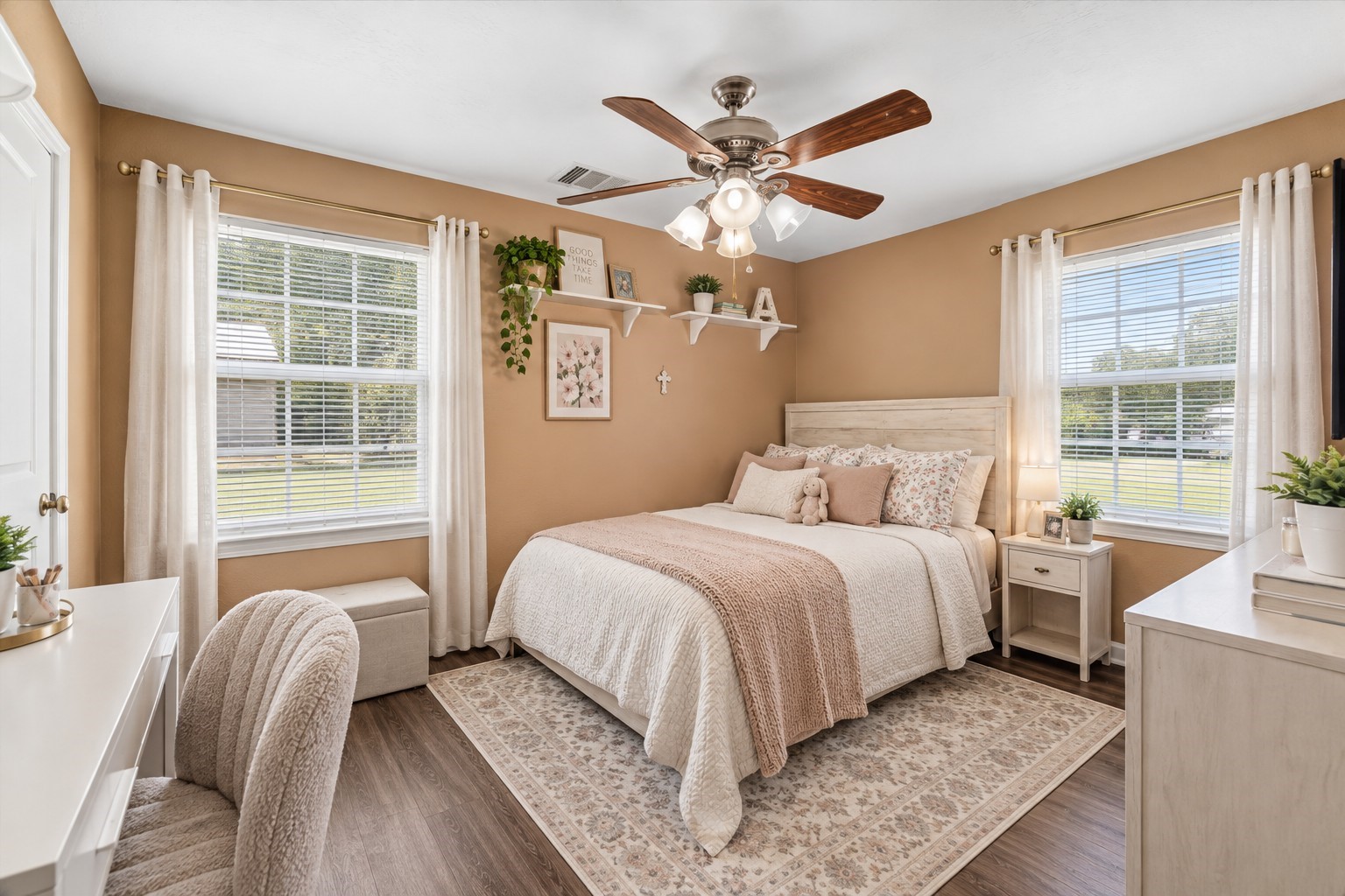 A bright and comfortable secondary bedroom offers plenty of space to personalize, with two windows bringing in beautiful natural light.