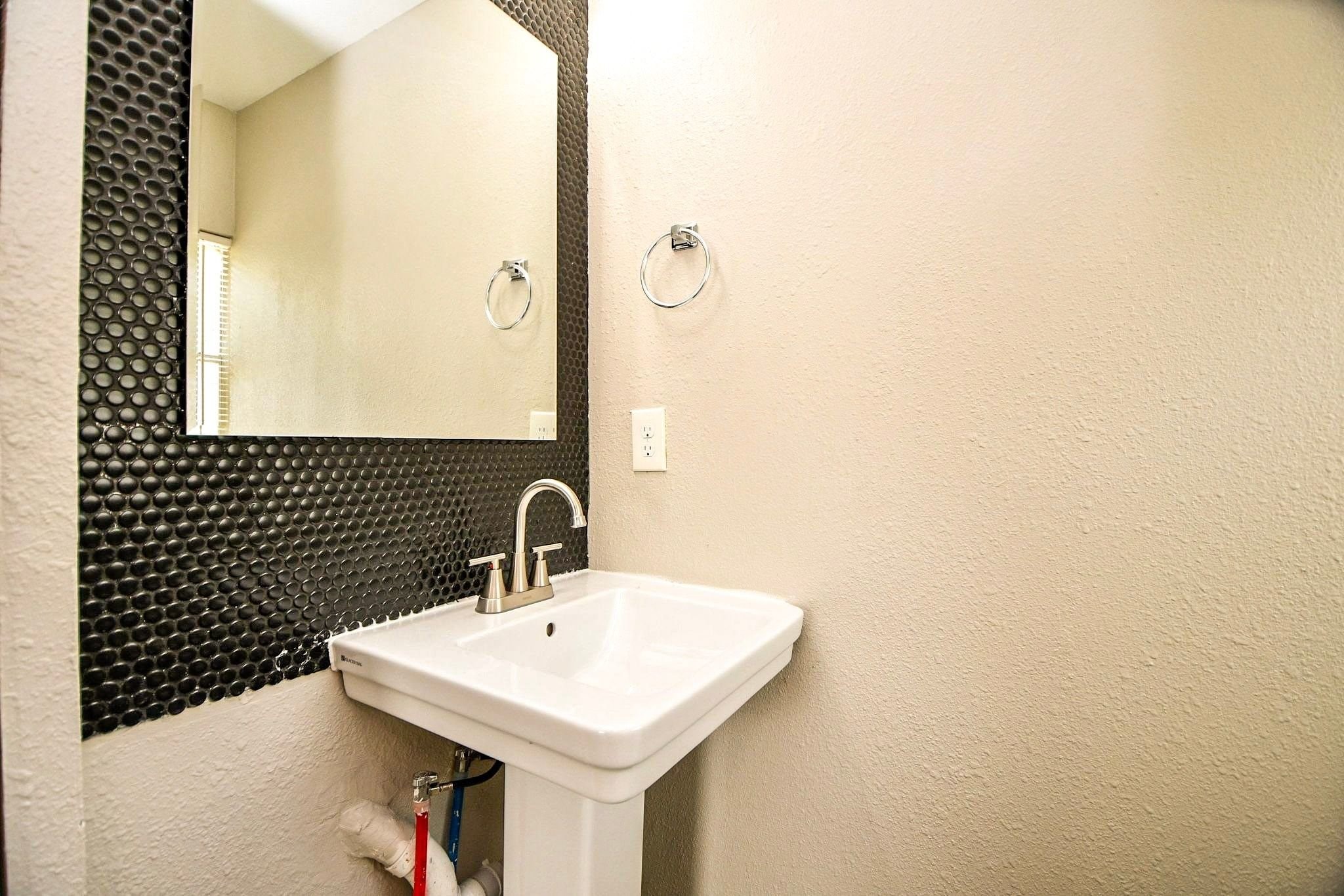 Half bathroom is located in bedroom three.
