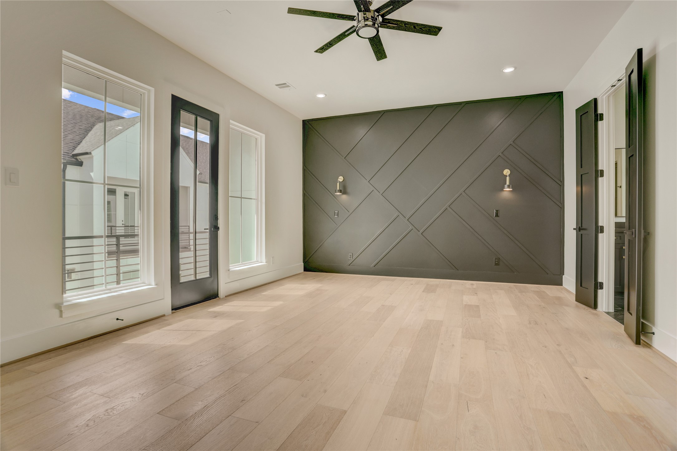 The primary suite sits on the third floor and offers a spa-like retreat.