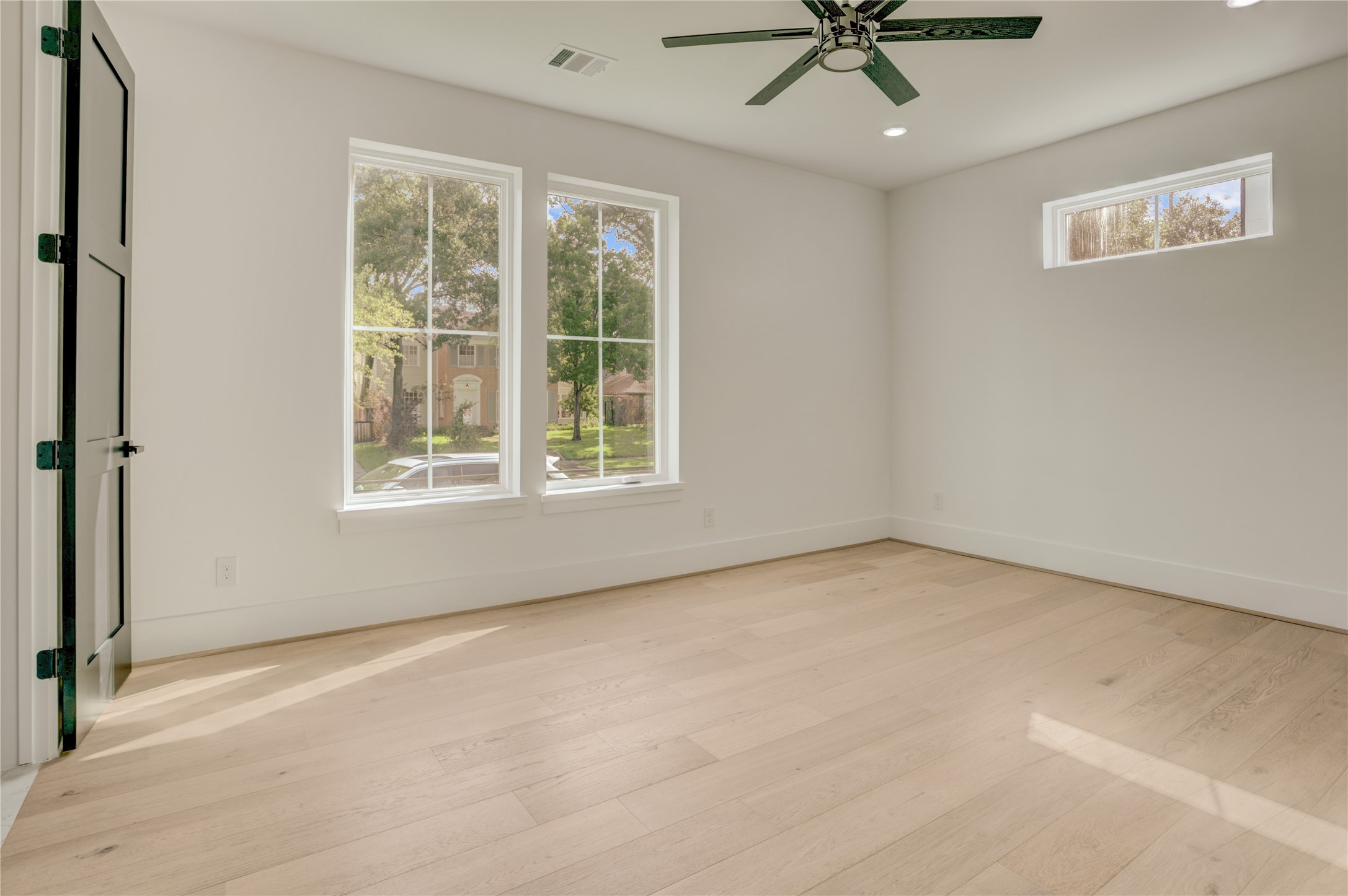 The first floor bedroom suite offers a sizable room and views of the yard space.
