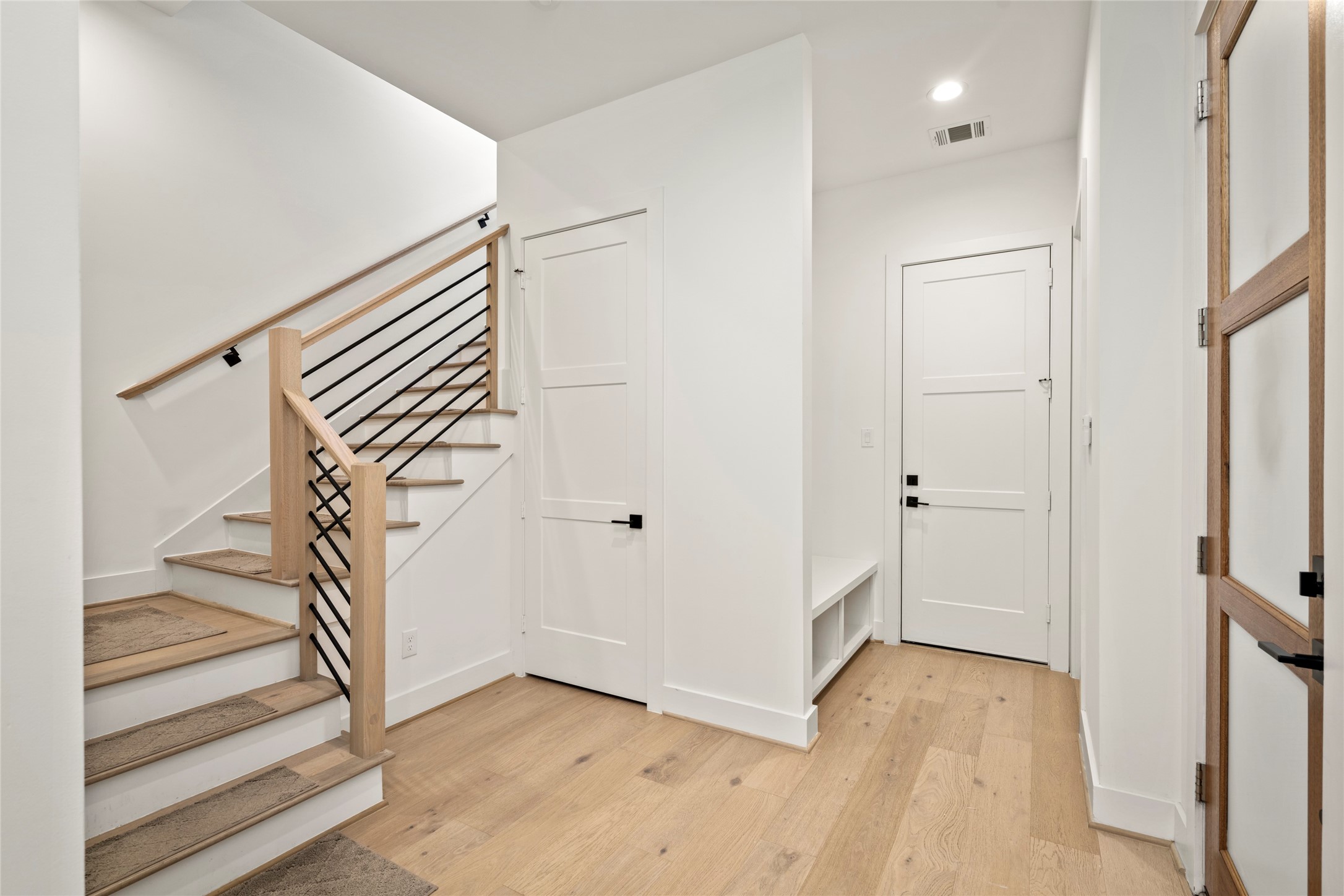 Spacious foyer as you enter the home.  Huge closet for storage under the stairs.  Mud area to the right with storage.  Door leads to the garage.  Half bath/Powder Room tucked away from the living areas.