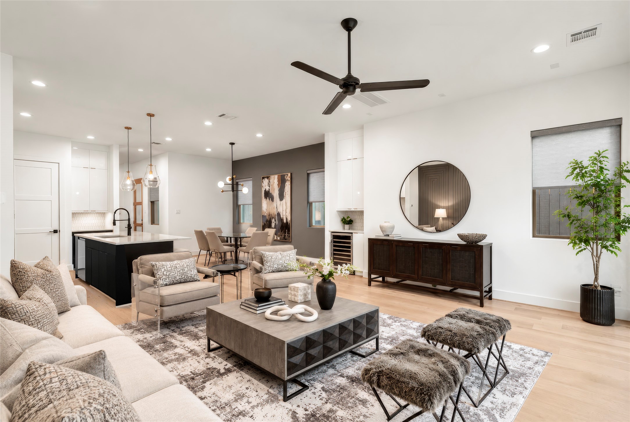 Gorgeous living room has plenty of room for furnishings.  Such flexible entertaining with living room, dining room and kitchen together in this transitional space.  Virtually rendered.
