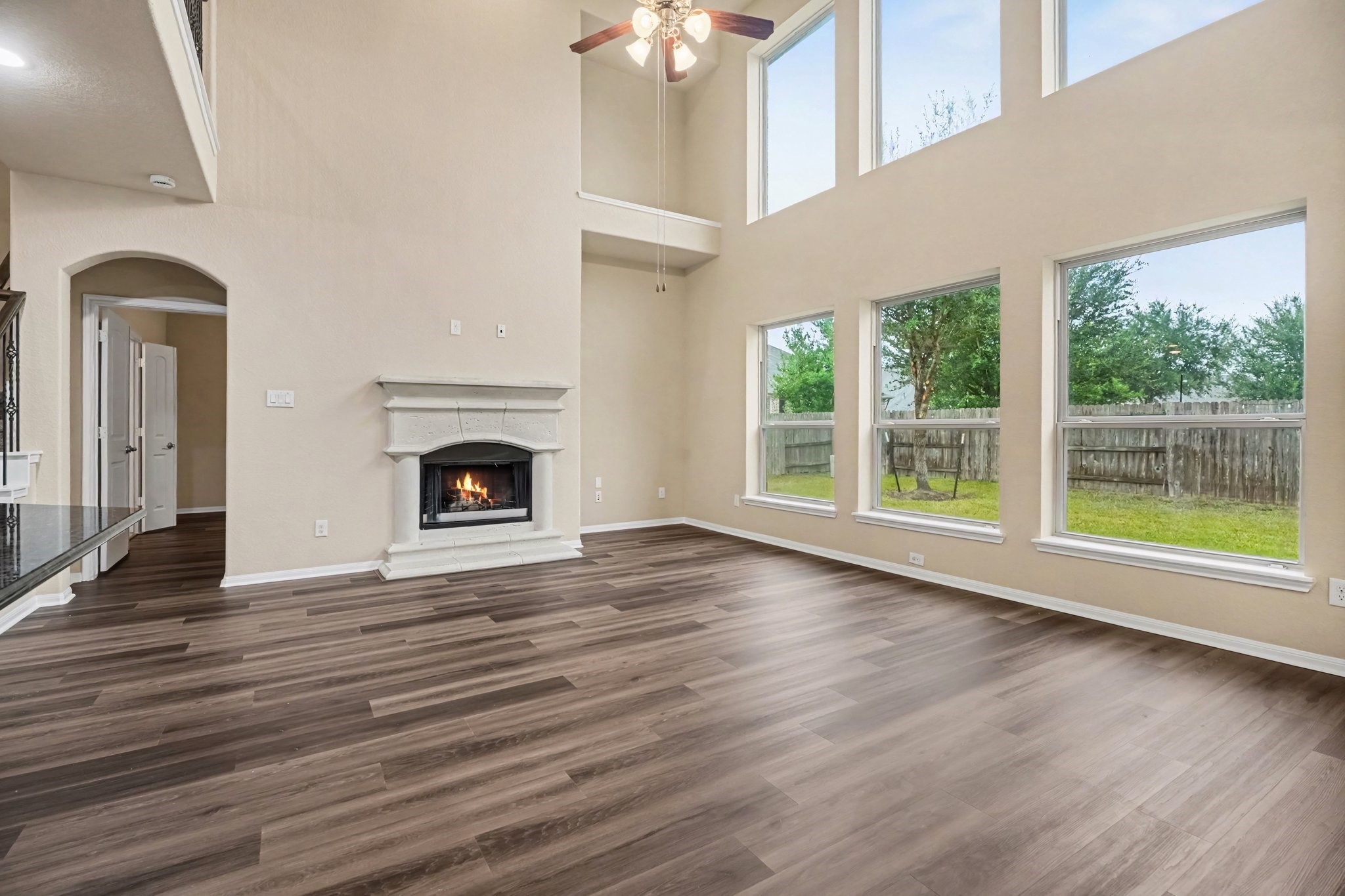 As we venture into the 2-story family room, the spaciousness opens up with natural light, and warmth from the gas fireplace will surely add special memories for all!