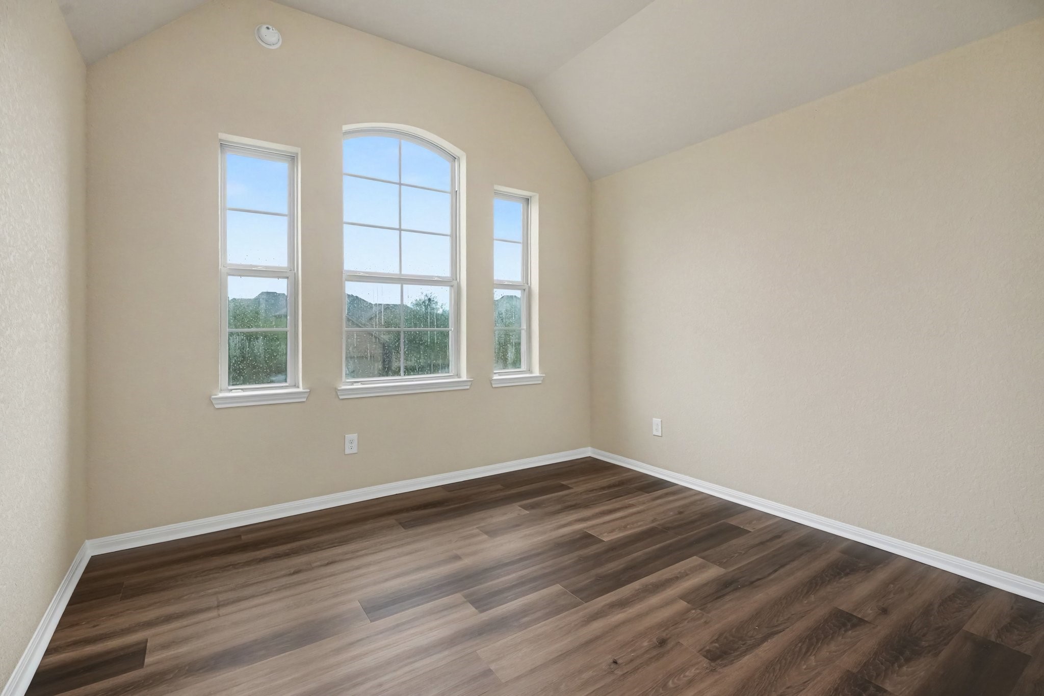 And the last of the secondary bedrooms with a wall of beautiful windows overlooking the trees!