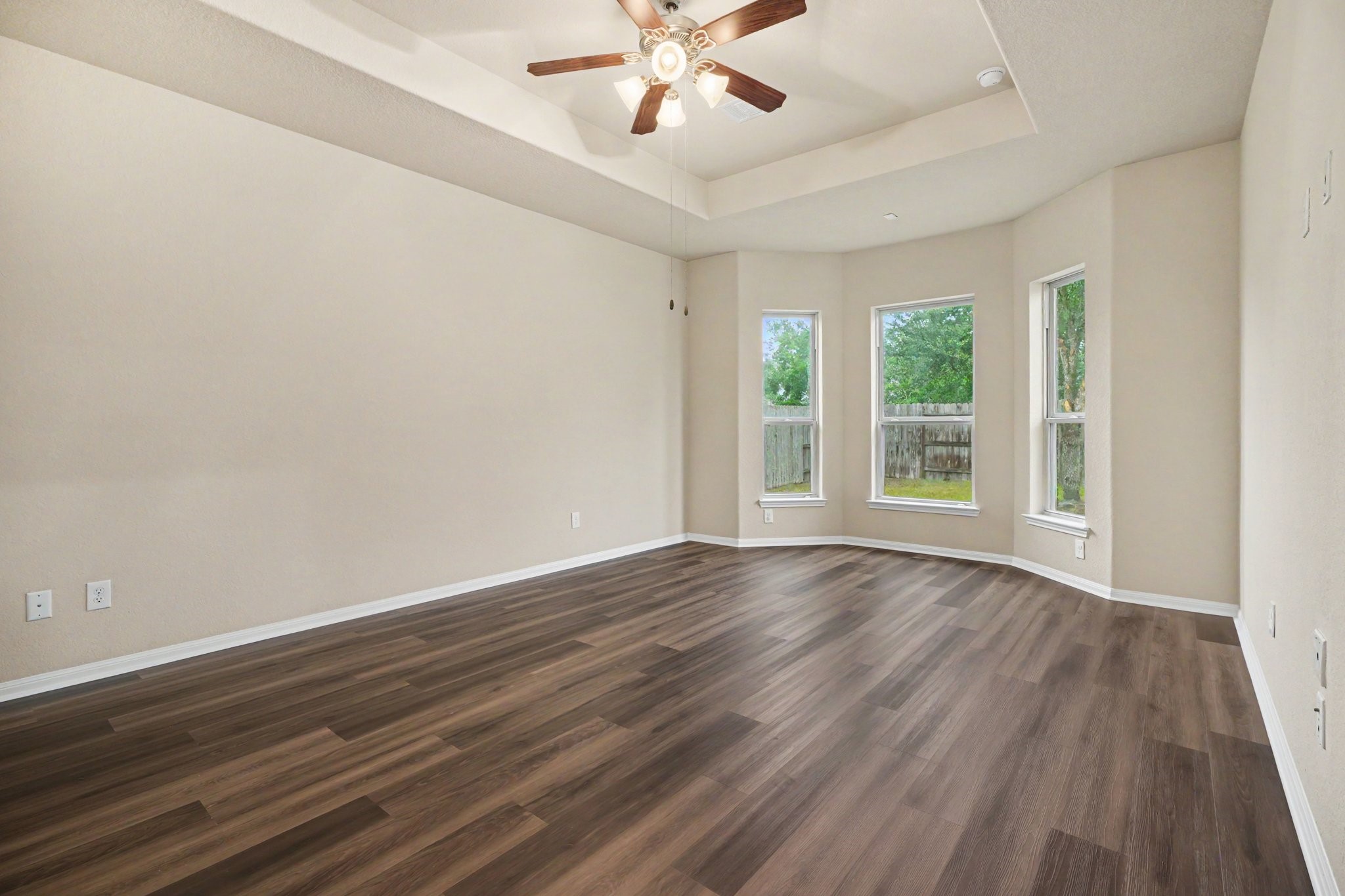 Welcome to the serene primary retreat with gorgeous LVP flooring, vaulted ceiling and bay windows!