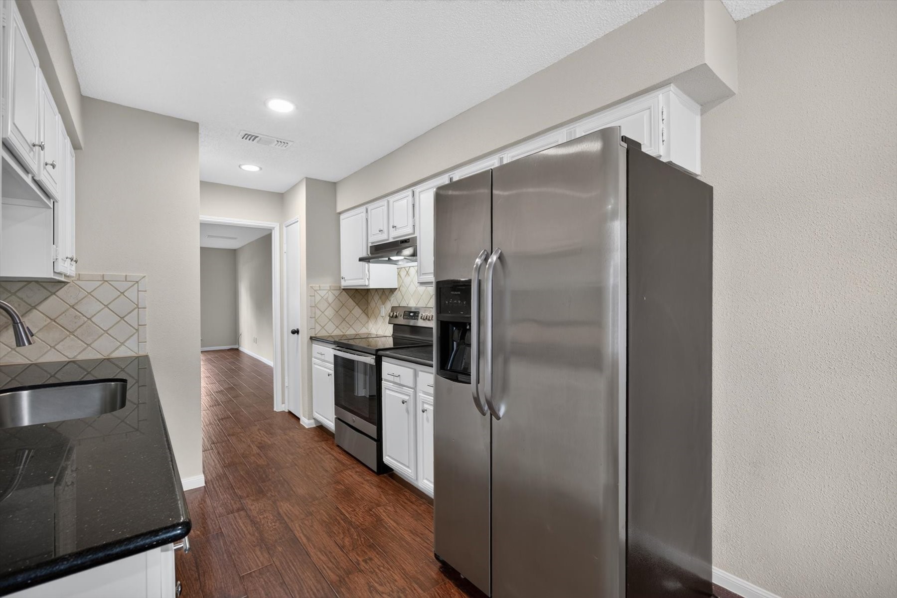 Stainless refrigerator stays with the home. This home is turn-key and ready for it's new owners.