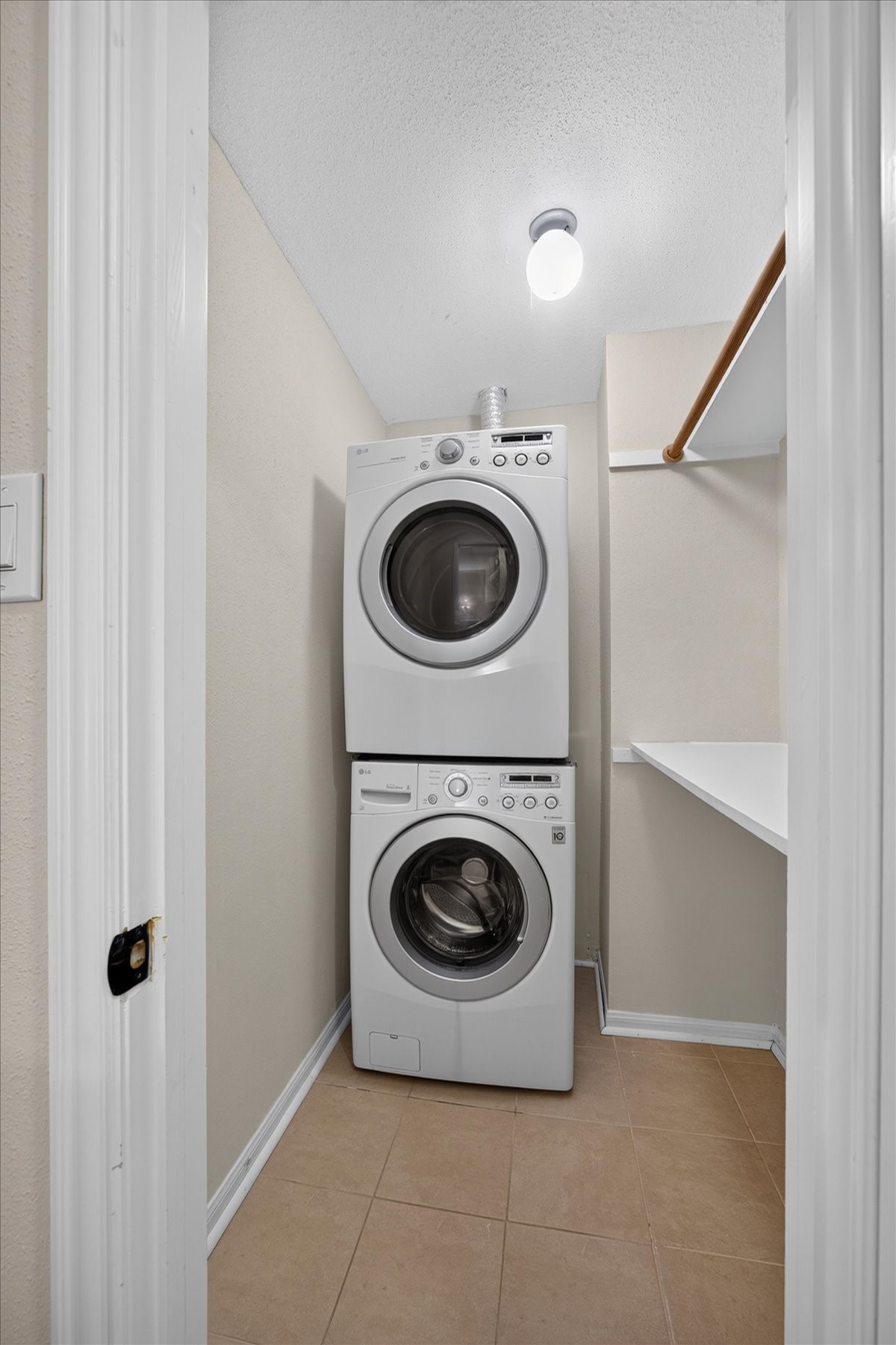 Laundry room upstairs. Washer and dryer convey with the home.