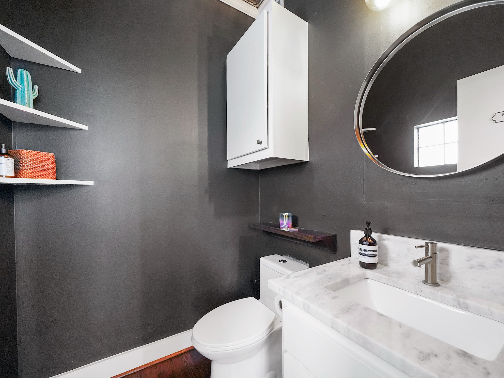 This sleek half bath combines modern fixtures with a clean, stylish design for ultimate convenience and elegance.