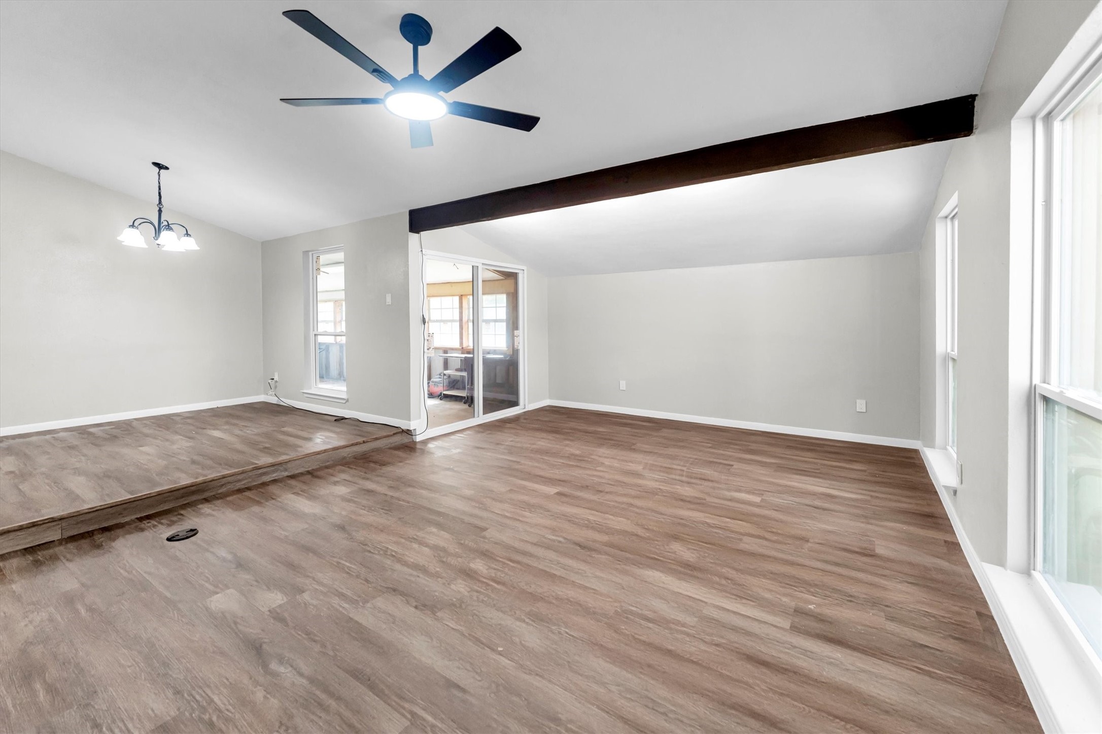 Living room open to Dining bonus Sunroom