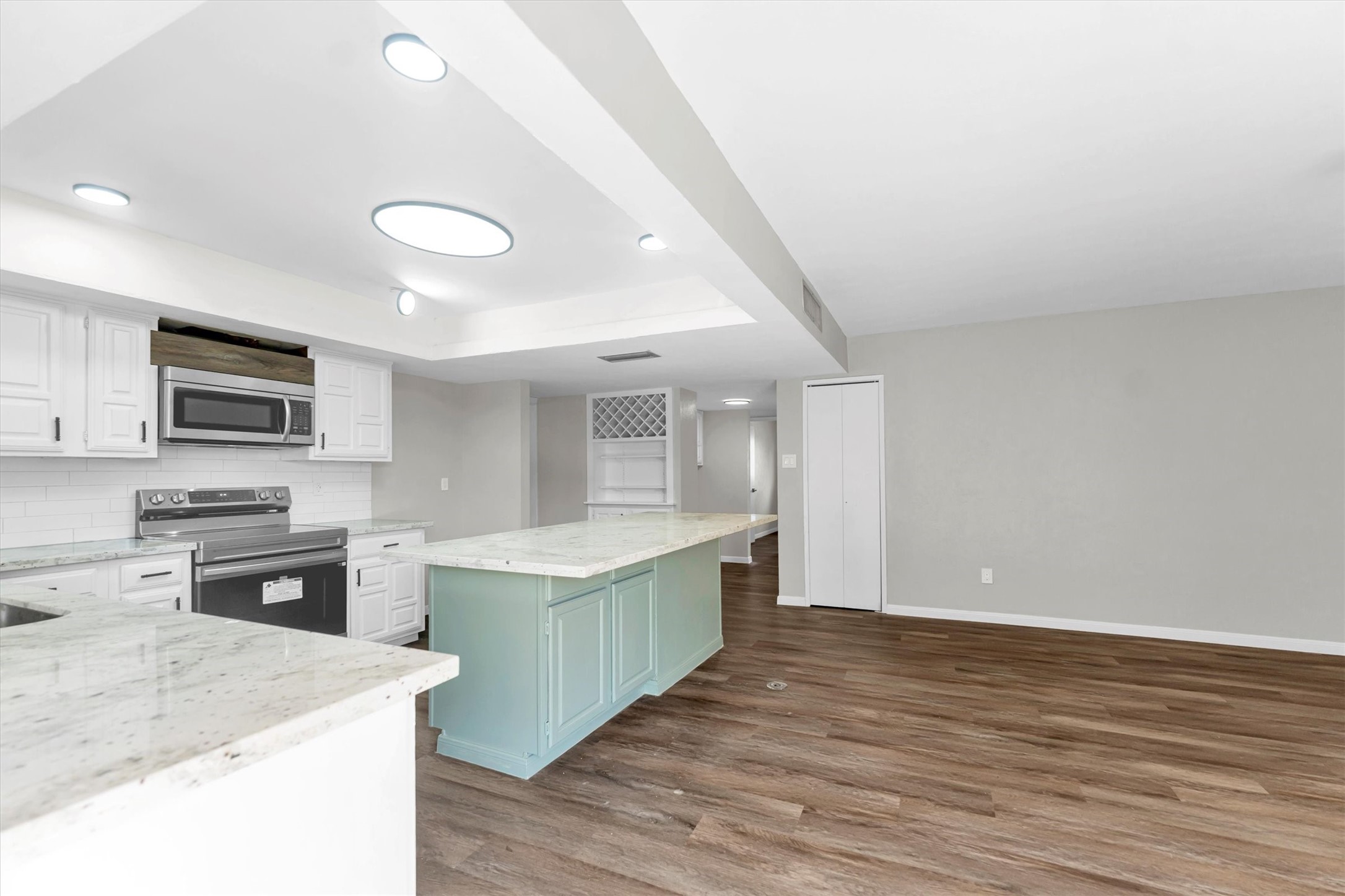 Granite countertops and new appliances in the kitchen