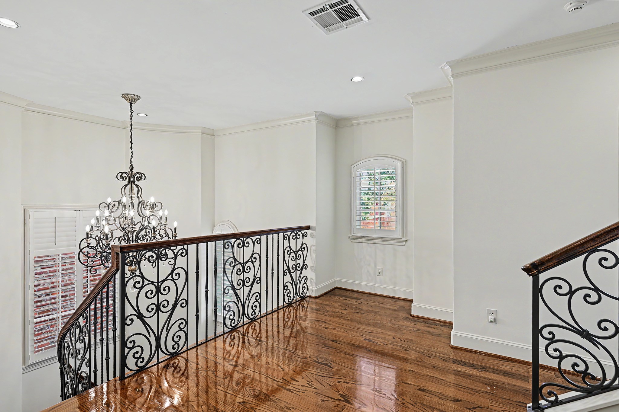 The spacious second floor landing offers flexible space for a seating area, study space, or reading nook.