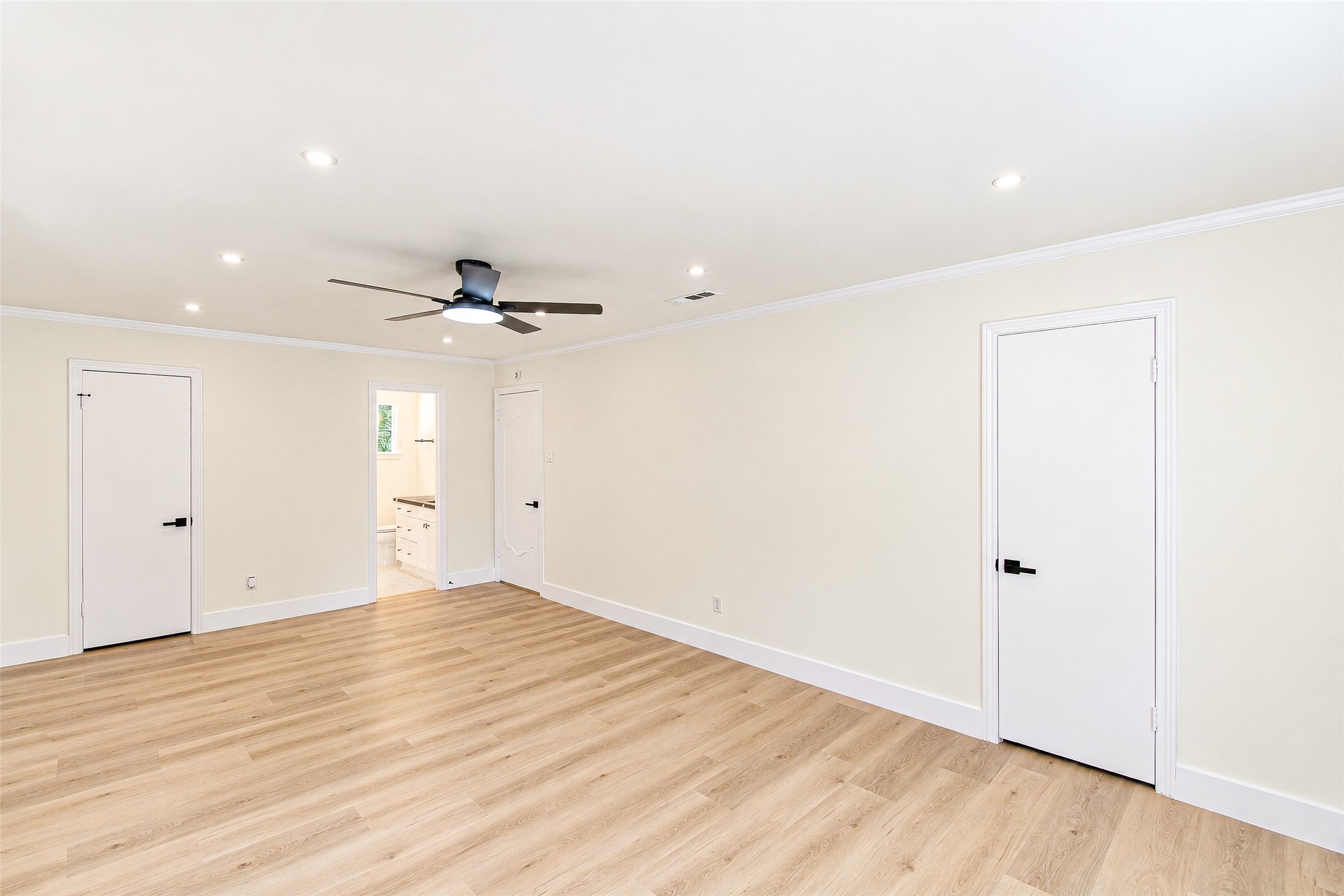 Spacious and inviting, Bedroom 3 features sleek vinyl flooring, recessed lighting, and a modern ceiling fan, creating a perfect blend of comfort and style.