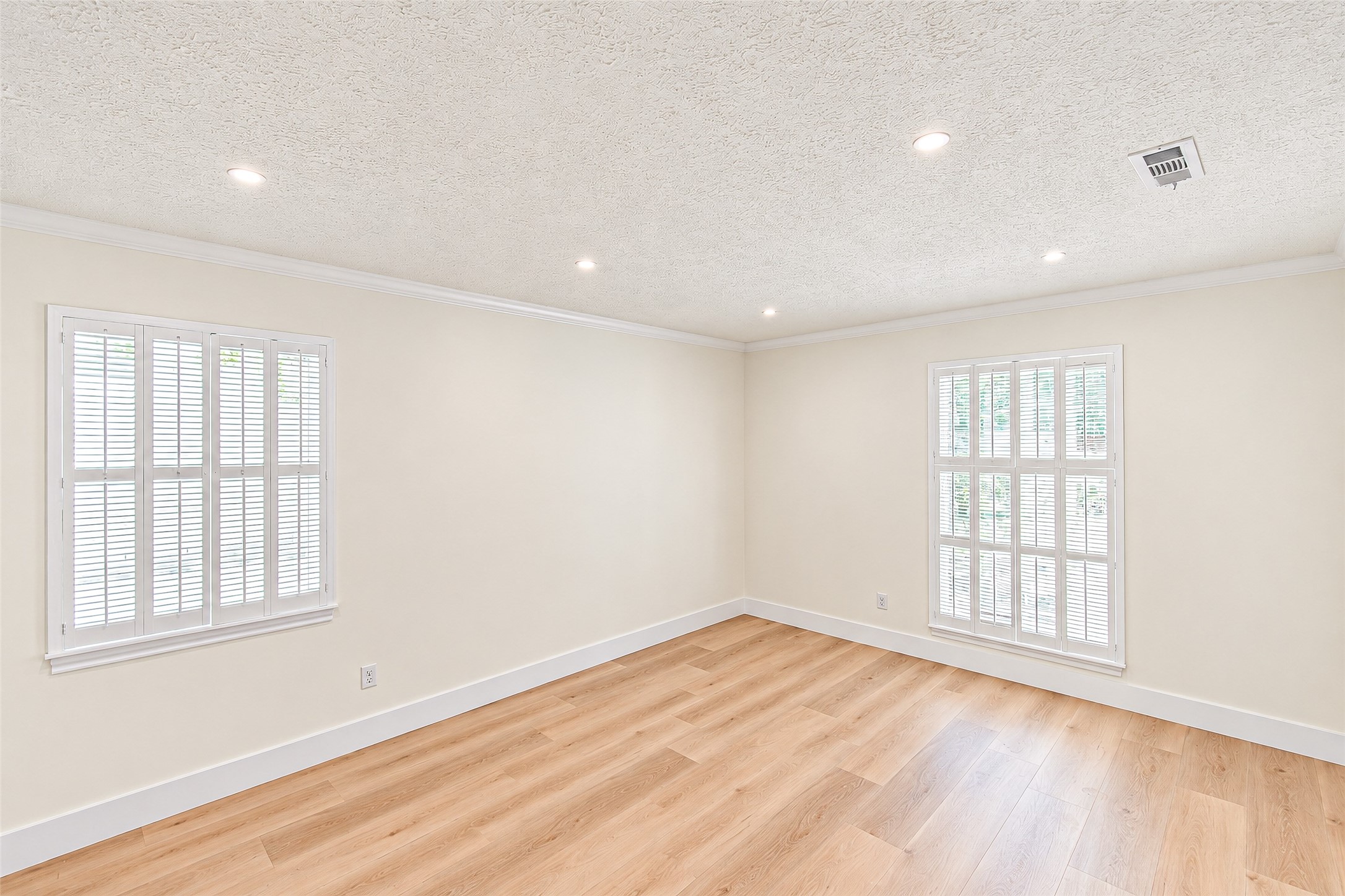 Bright and inviting, this study features abundant natural light streaming through elegant windows, creating an ideal space for productivity and inspiration.