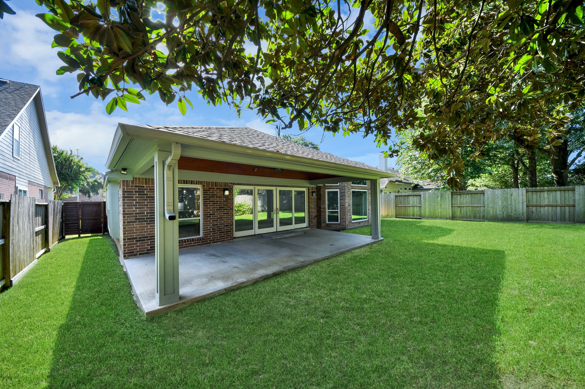 View of the back yard and the back of the home