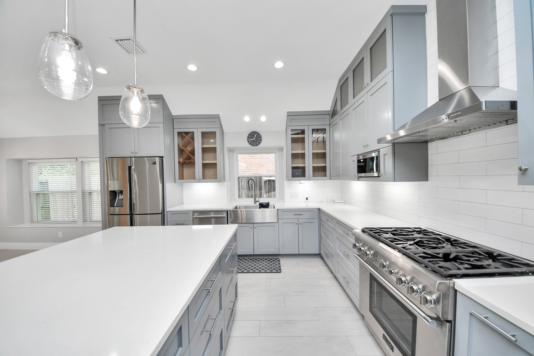 A chefs dream of a kitchen! Open concept and guaranteed to wow with soft closing custom solid wood cabinetry, Thermador 6 burner range, built in microwave, seamless quartz countertops, pendant lights and a vent hood to blow away all your steam.