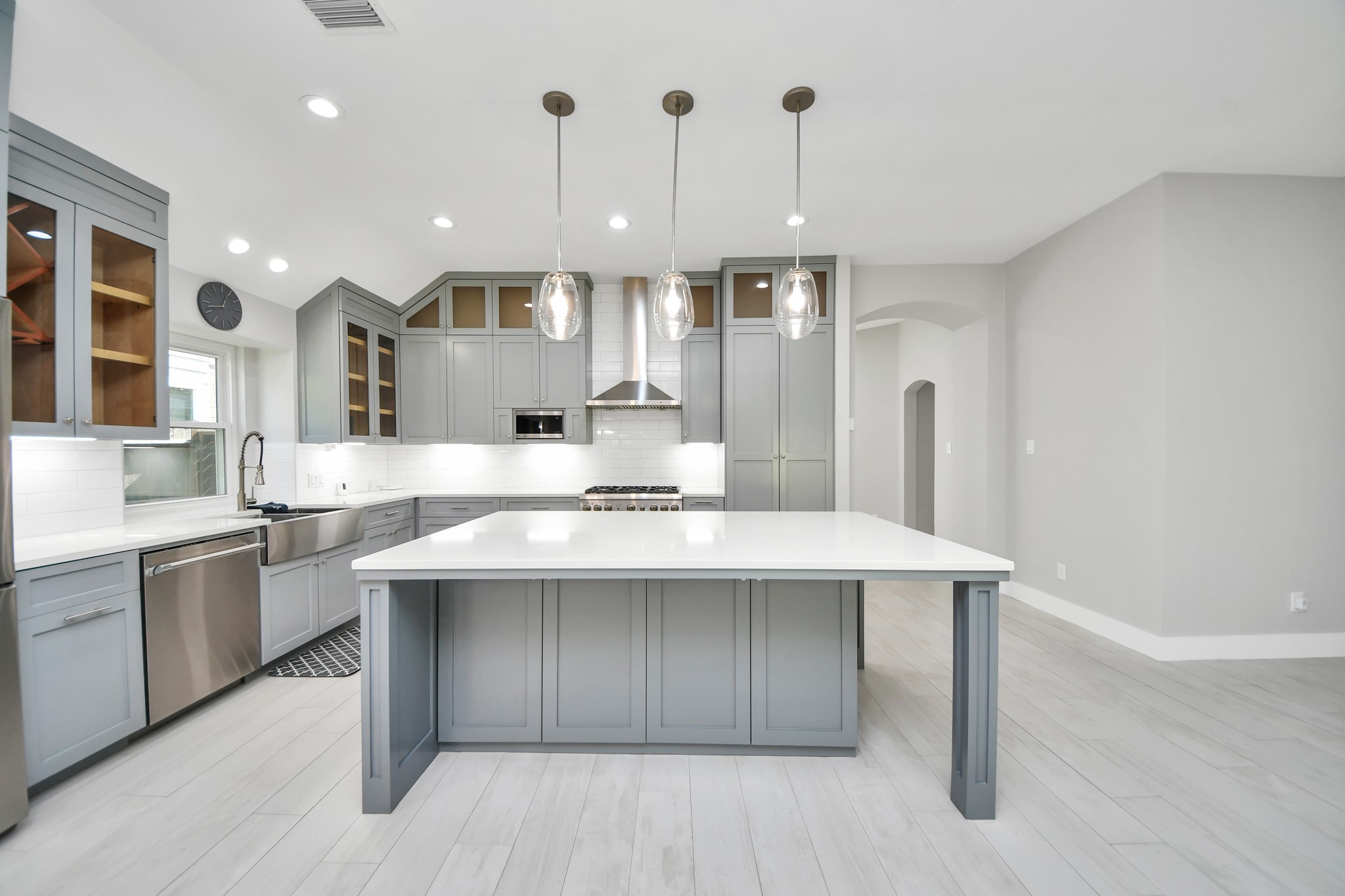 A chefs dream of a kitchen! Open concept and guaranteed to wow with soft closing custom solid wood cabinetry, Thermador 6 burner range, built in microwave, seamless quartz countertops, pendant lights and a vent hood to blow away all your steam.