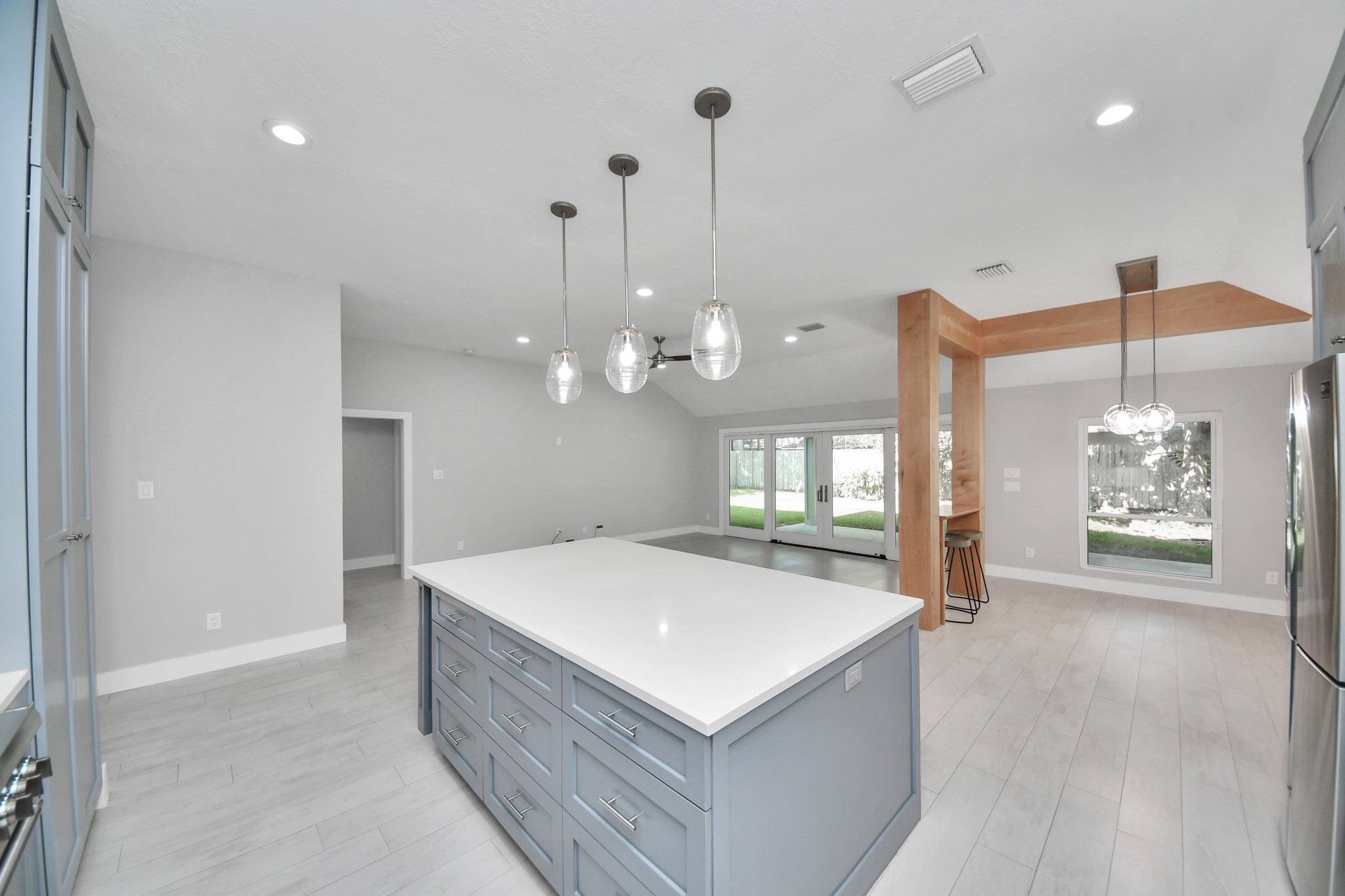 A chefs dream of a kitchen! Open concept and guaranteed to wow with soft closing custom solid wood cabinetry, Thermador 6 burner range, built in microwave, seamless quartz countertops, pendant lights and a vent hood to blow away all your steam.
