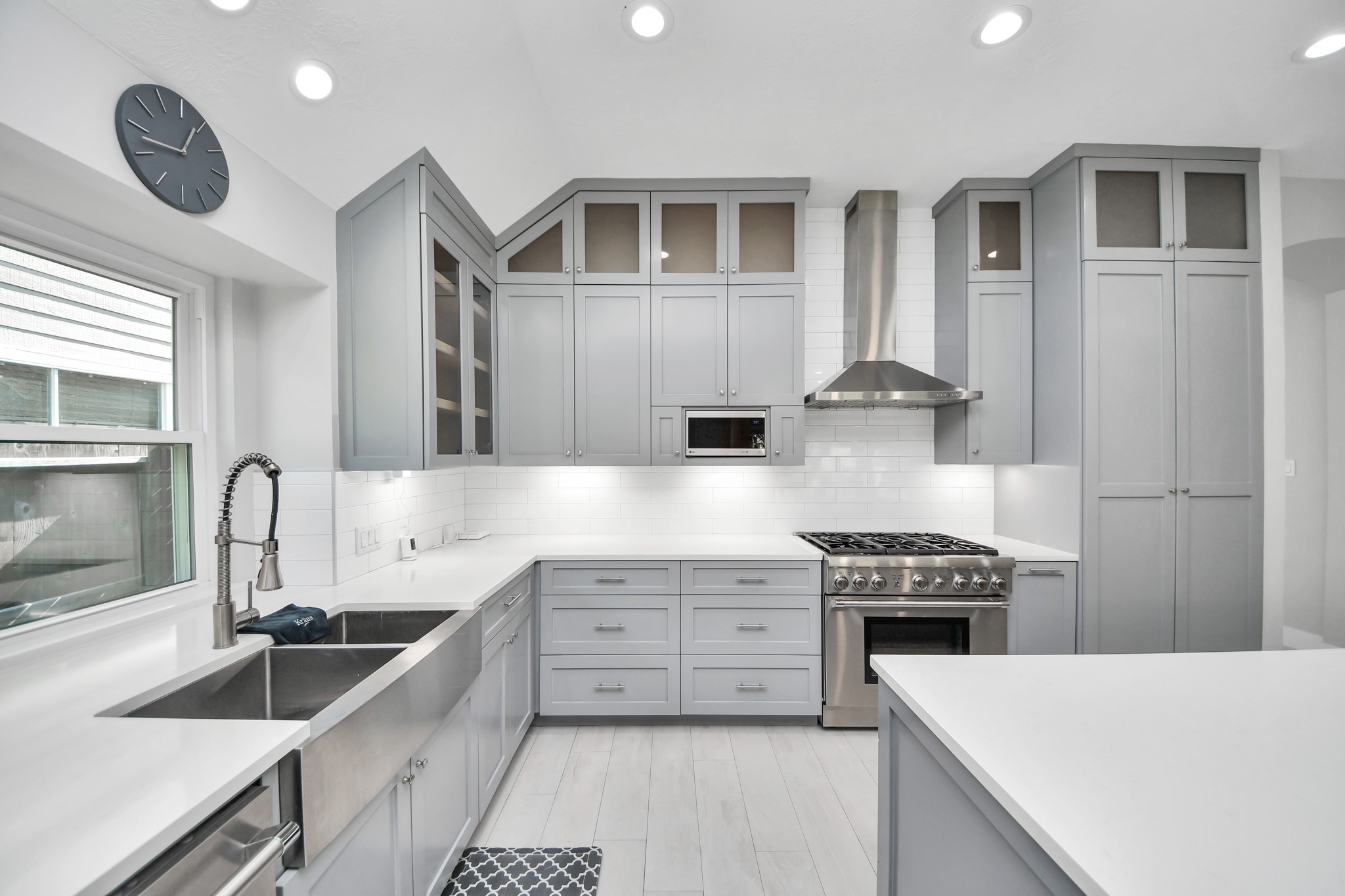 A chefs dream of a kitchen! Open concept and guaranteed to wow with soft closing custom solid wood cabinetry, Thermador 6 burner range, built in microwave, seamless quartz countertops, pendant lights and a vent hood to blow away all your steam.