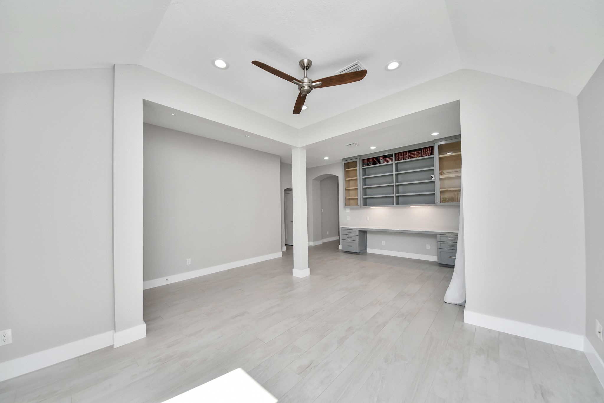 Formal living/seating area and built in library or study all made custom with solid wood.
