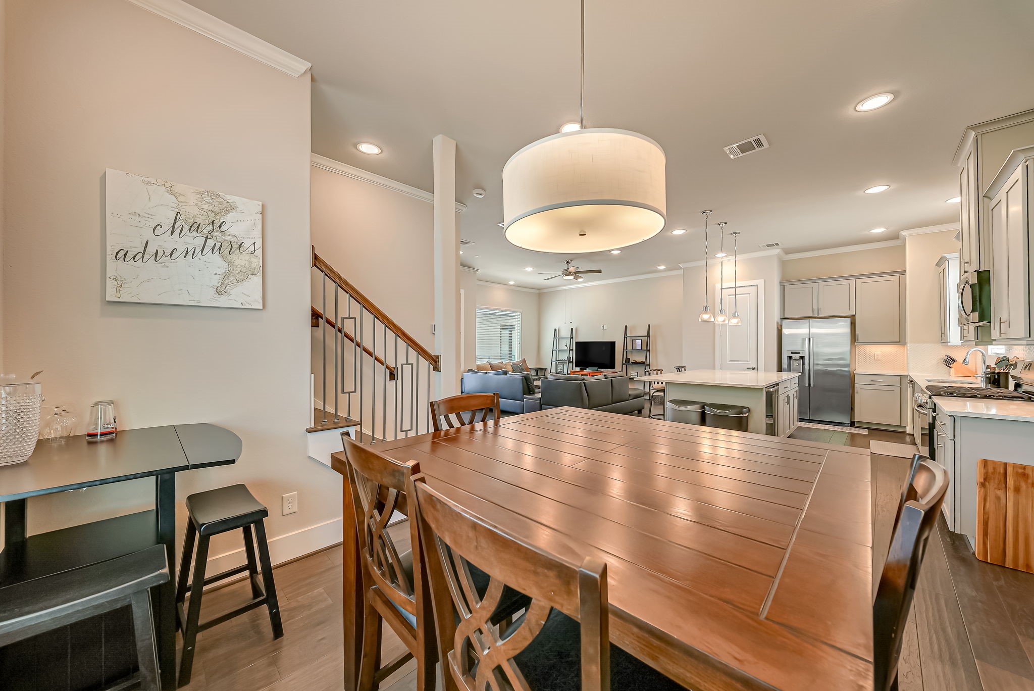 Expansive second-floor living area with seamless flow between the kitchen, dining, and gathering spaces.