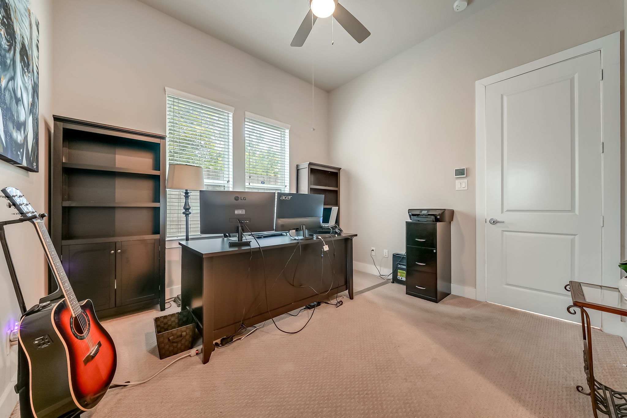 Flexible third bedroom that can easily function as a private home office, study, or guest suite.