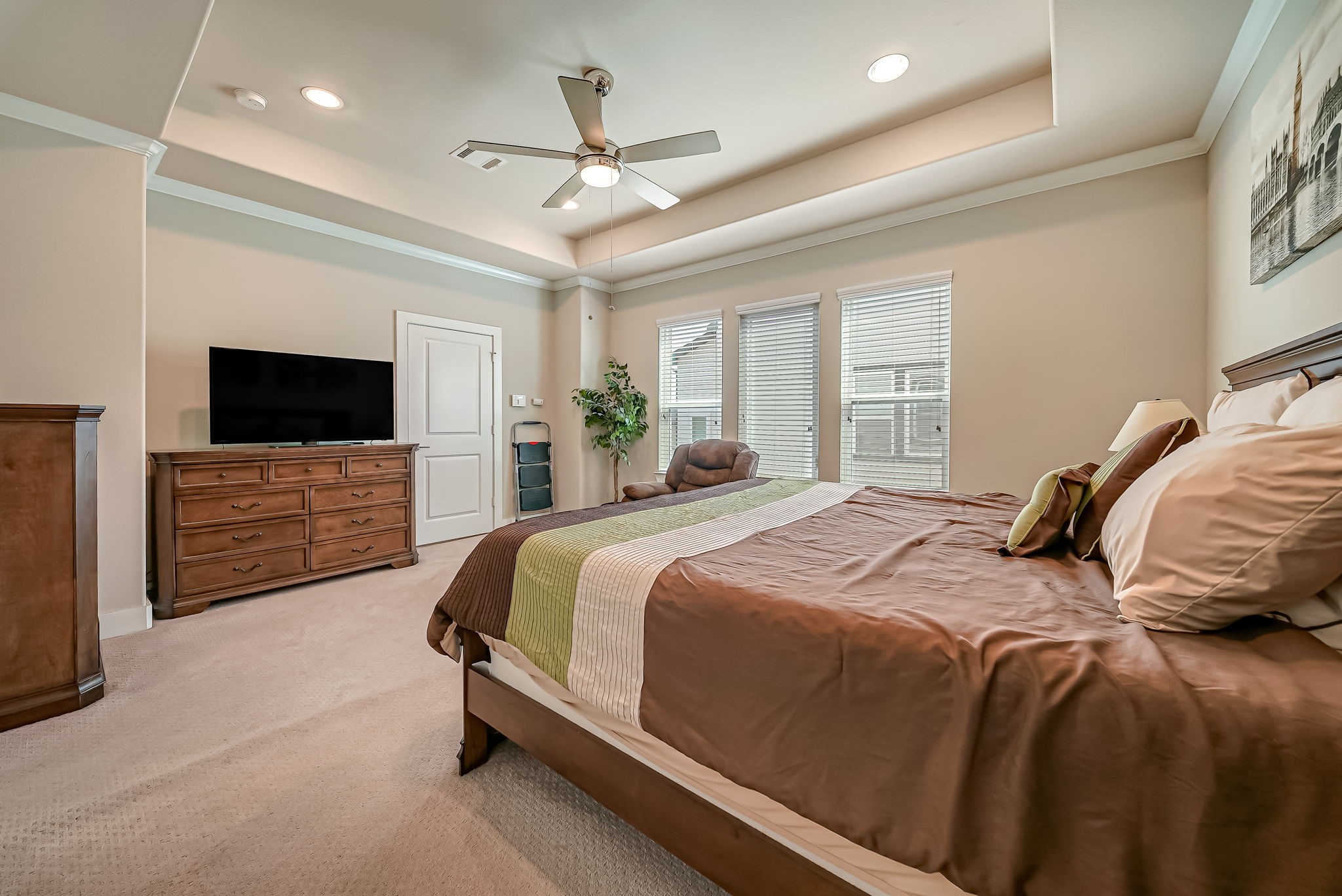 Generously sized primary suite offering a private retreat with ensuite bath and walk-in closet.