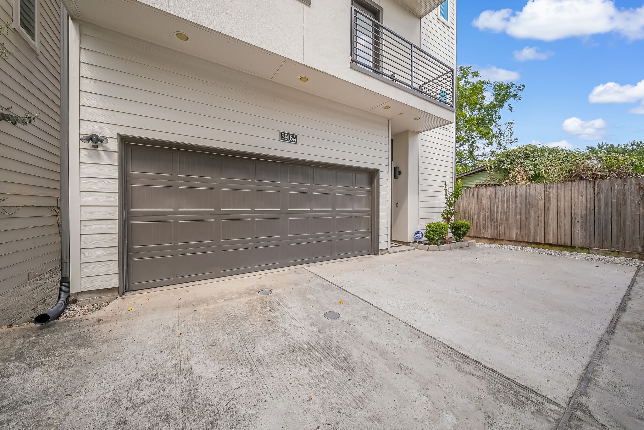 Attached two-car garage with extra parking space, a valuable feature in this Inner Loop location.