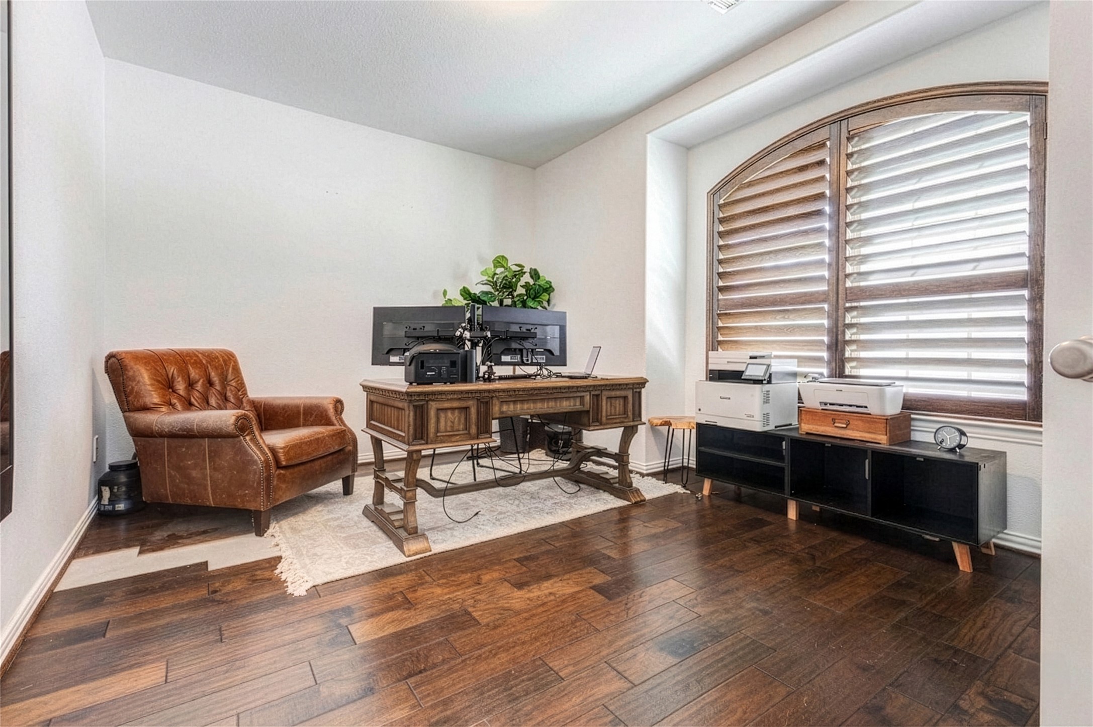 Bright home office with plenty of space for a desk and storage, perfect for working from home.