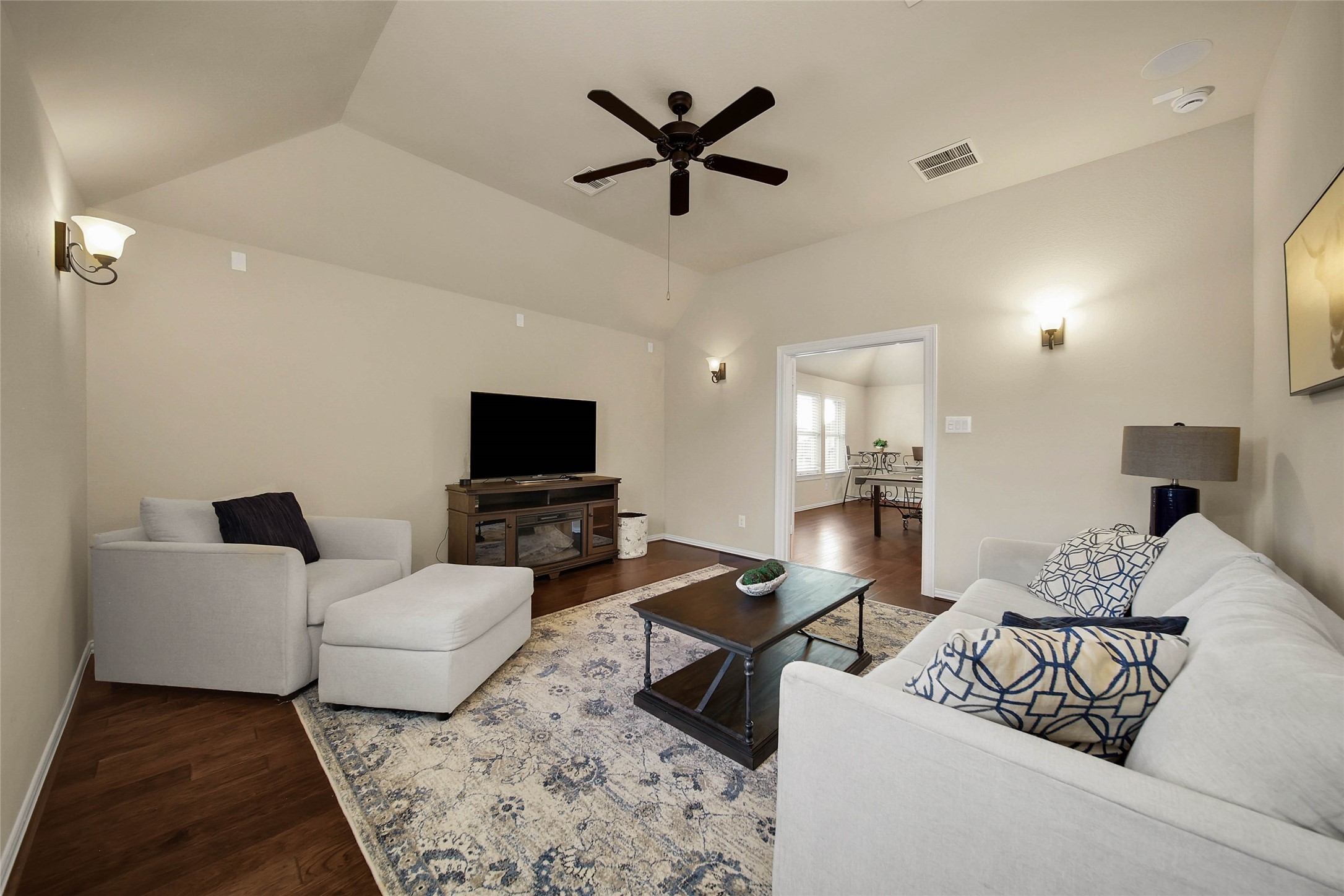 Directly adjacent to the game room, the dedicated media room features a convenient AV closet, making it the perfect setup for movie nights and immersive entertainment.