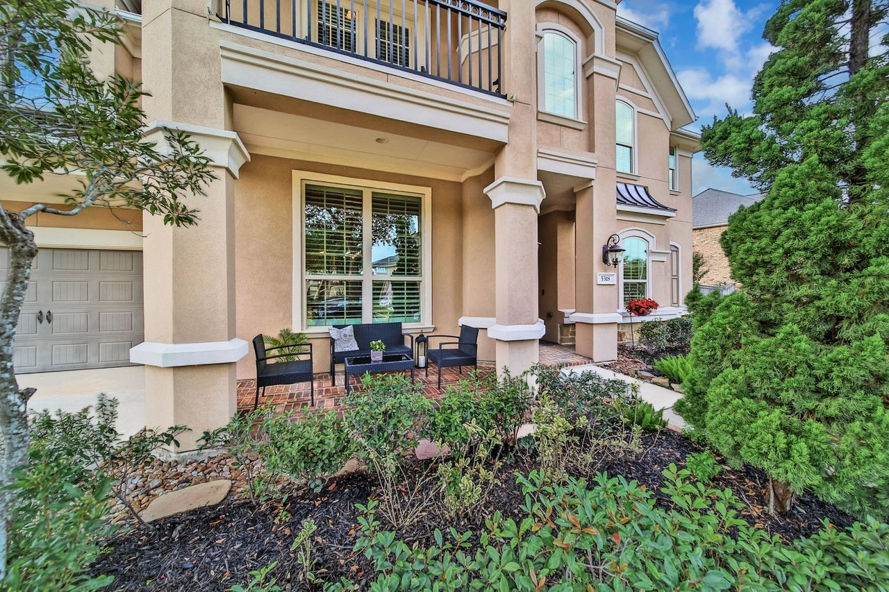 The charming front porch offers the perfect spot to sip morning coffee or unwind with a glass of wine, and reflect on the day while enjoying a beautiful evening sunset.