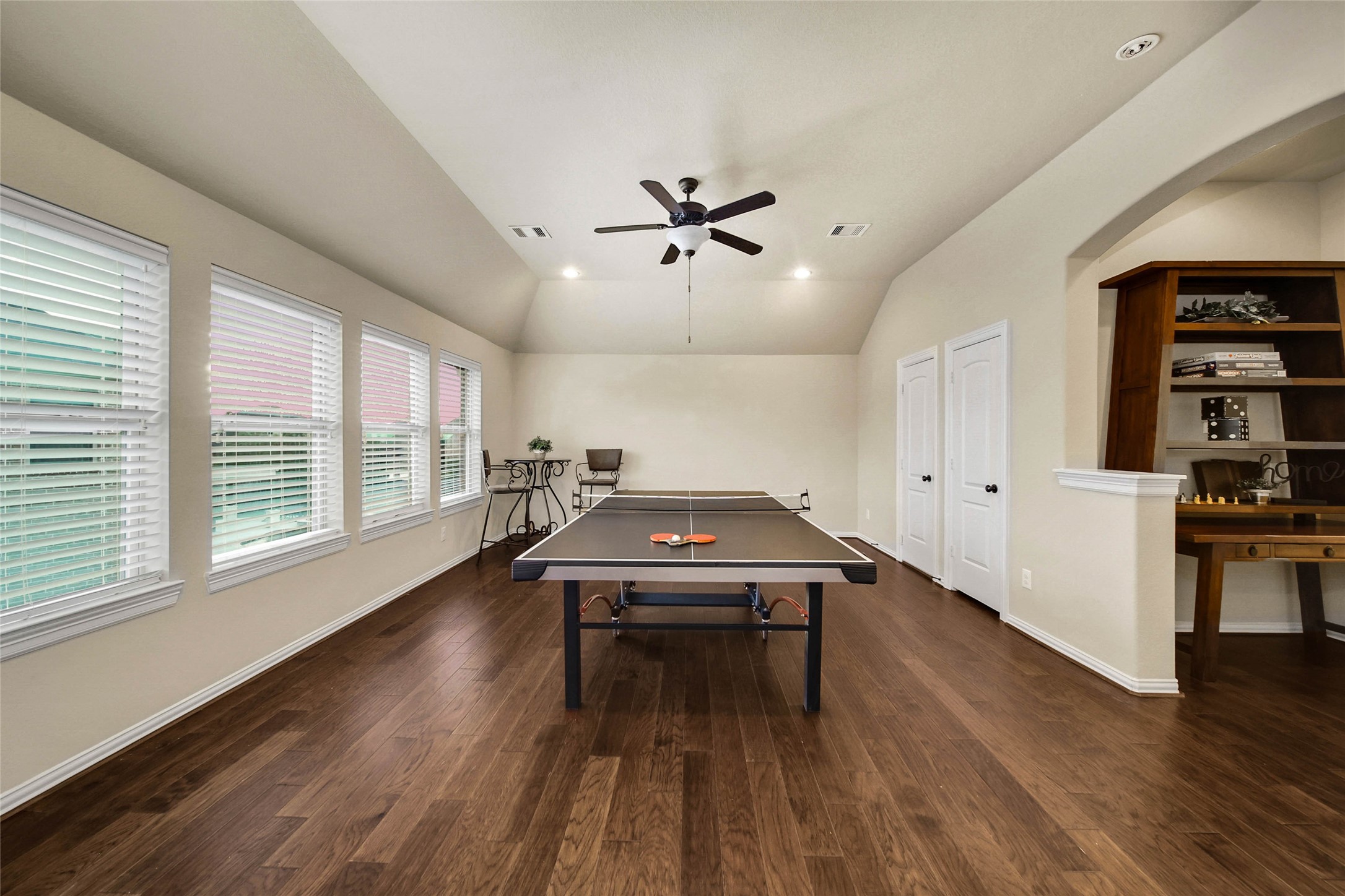 Plenty of space for all the FUN you have in mind! The spacious game room offers a convenient storage closet and walk-in attic access, providing valuable extra space to keep everything organized. Bonus- Ping Pong Table Stays!
