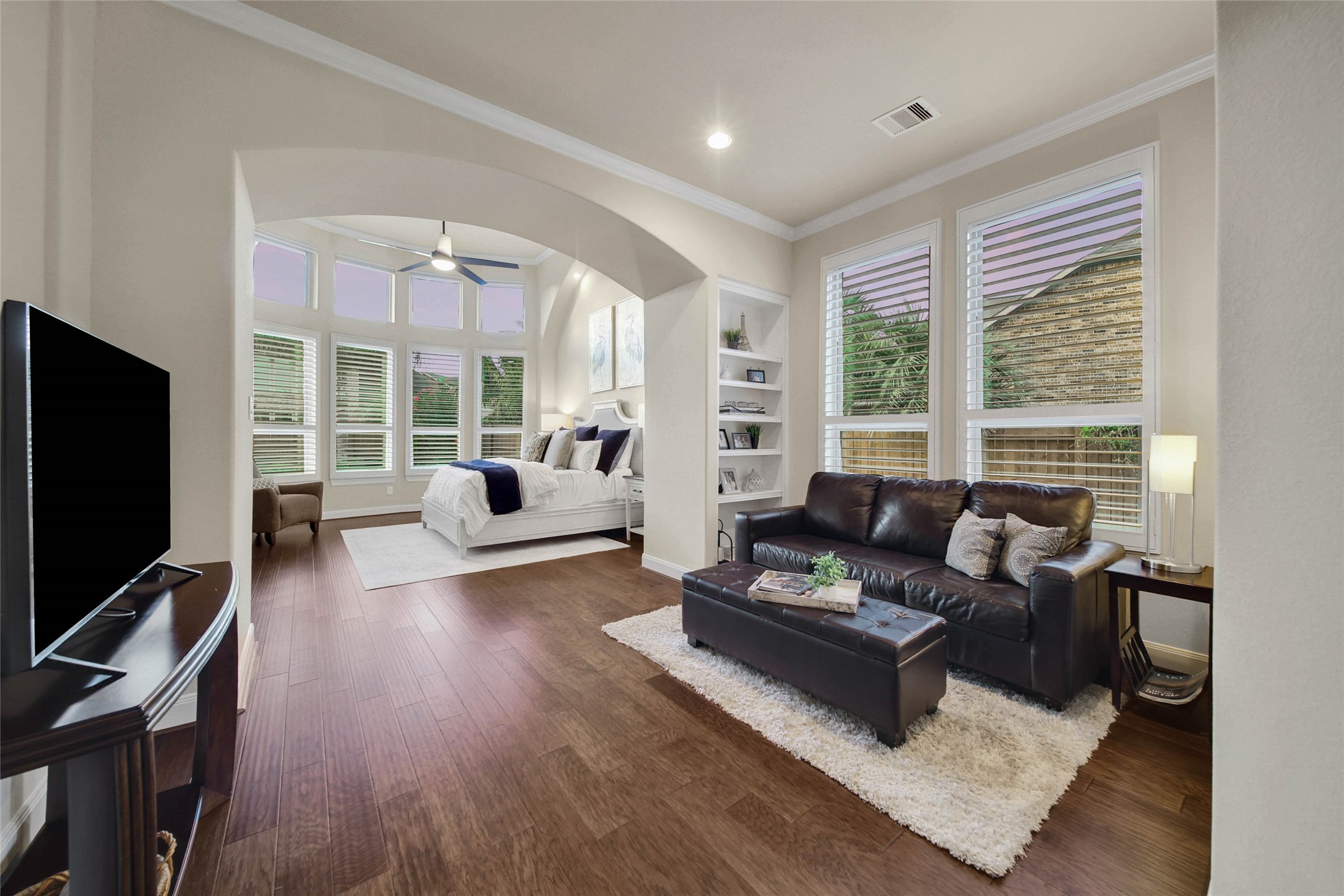 The spacious primary suite features a dedicated sitting area, creating a peaceful retreat to unwind, read, or enjoy a quiet moment at the end of the day.