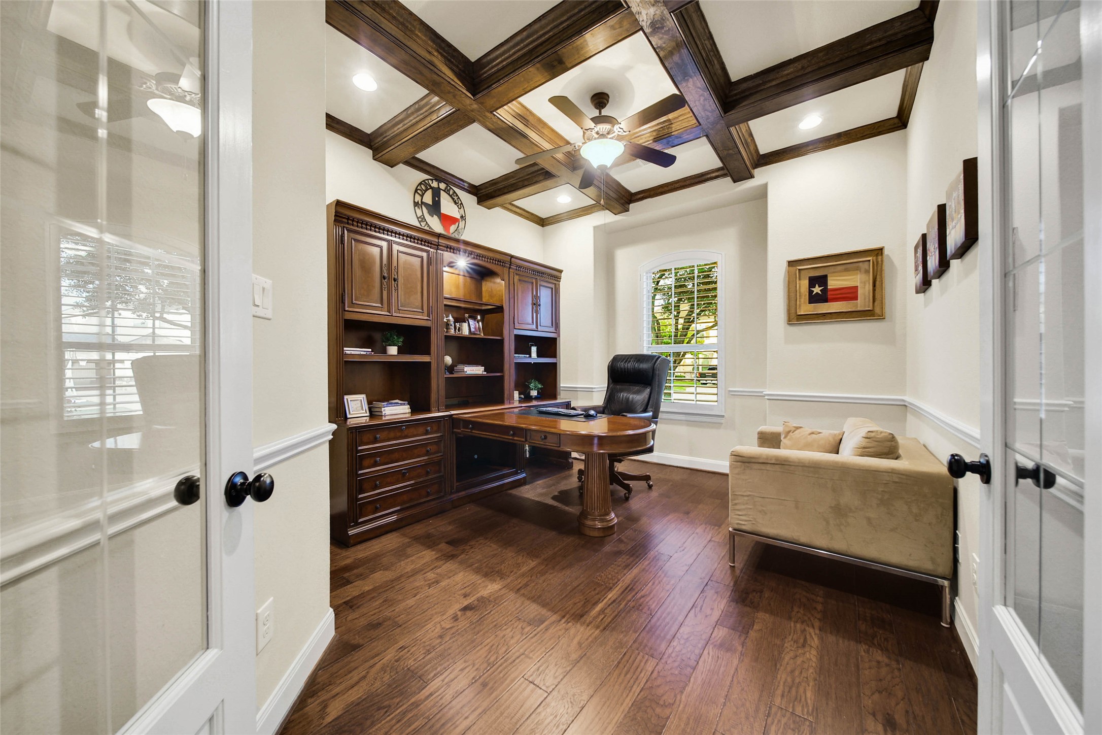 Handsome Study with cross beamed ceiling provides the ideal space to conduct business or just keep your family organized. Glass front french doors offer privacy when needed.