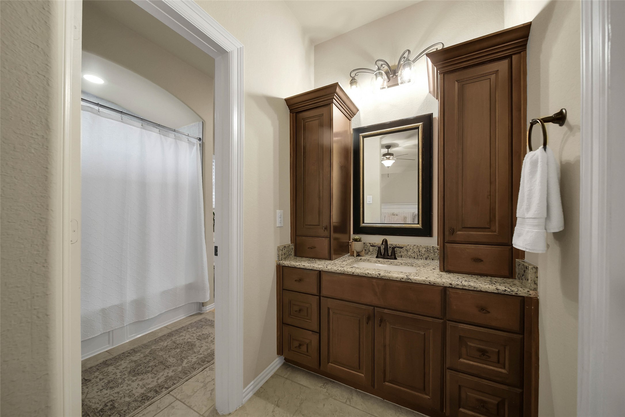 This bedroom features a private vanity area and connects to Bedroom 4 through a convenient shared bathroom, offering both functionality and privacy.