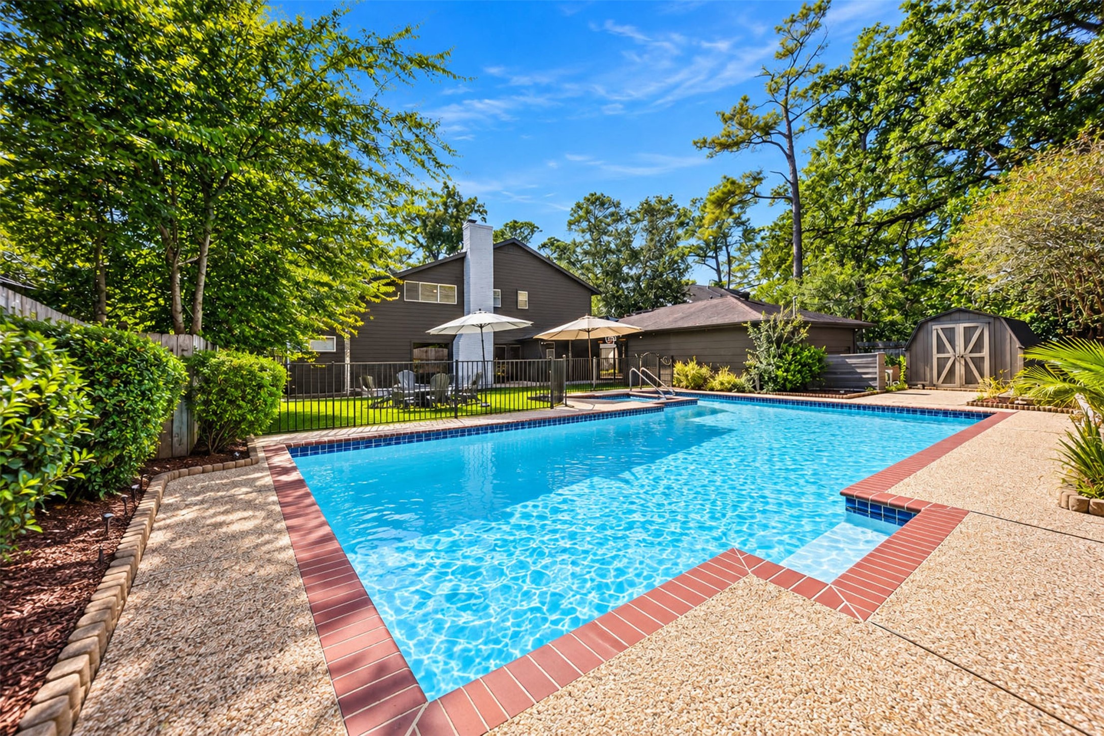 Private In-Ground Pool: Your own backyard oasis! Beautiful in-ground swimming pool surrounded by spacious decking, mature landscaping, and plenty of room for outdoor entertaining.