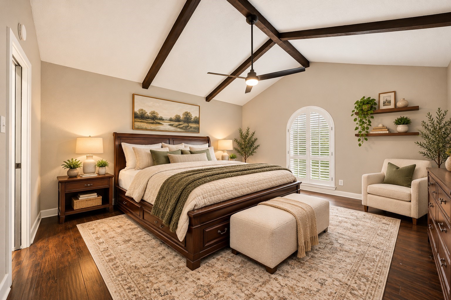 Primary Bedroom (Virtually Staged)
Spacious primary retreat showcasing a stunning vaulted ceiling with exposed wood beams, beautiful wood flooring, and a distinctive arched window with plantation shutters. An elegant space filled with warmth and architectural character.
