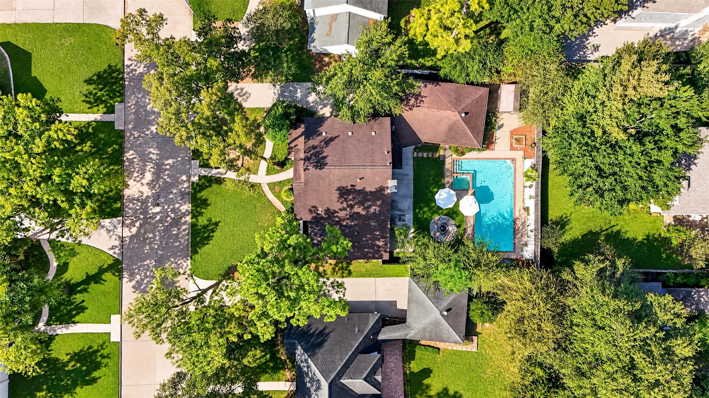 Aerial Property View
Impressive aerial view showcasing the property's generous lot, mature landscaping, expansive backyard, and private swimming pool with adjoining spa.