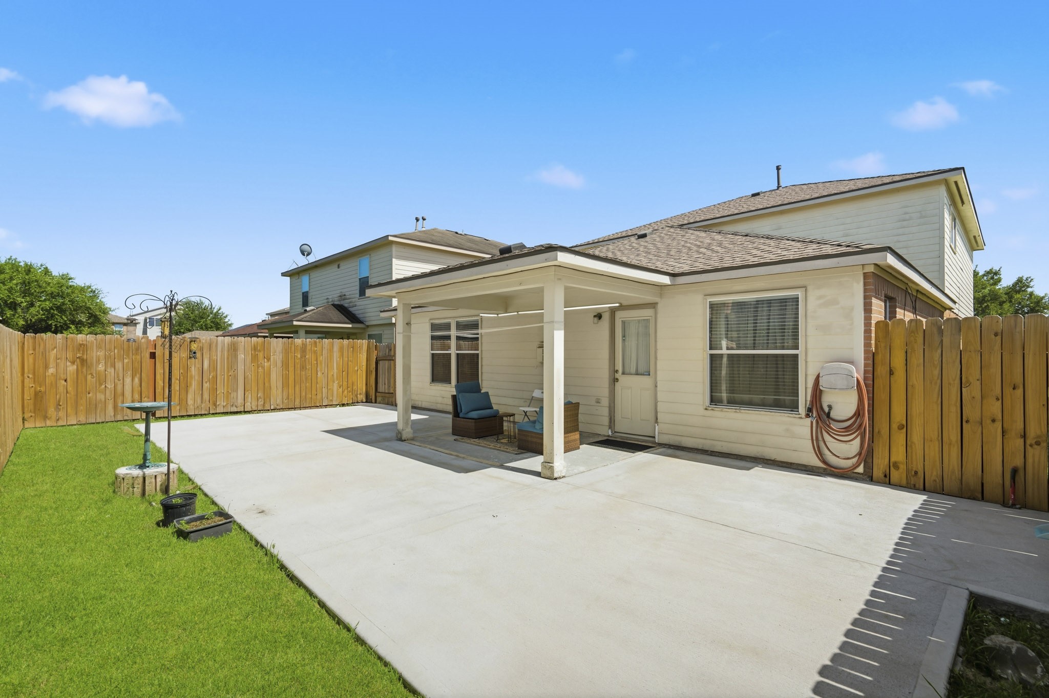A spacious patio extends the living area outdoors, offering plenty of room for dining, grilling and entertaining.