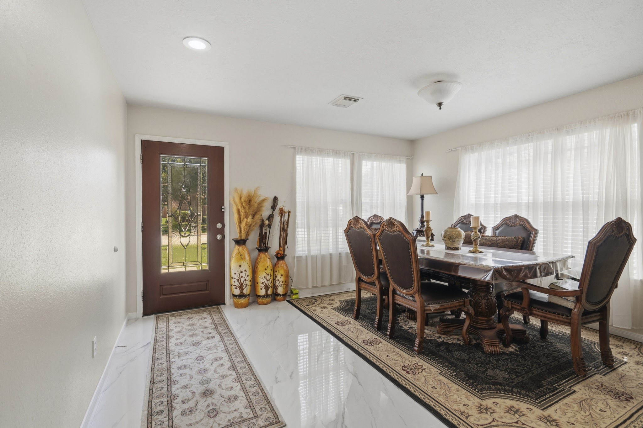 Gather for holiday meals, dinner parties and special occasions in the spacious formal dining room filled with natural light. Gather for holiday meals, dinner parties and special occasions in the spacious formal dining room filled with natural light.